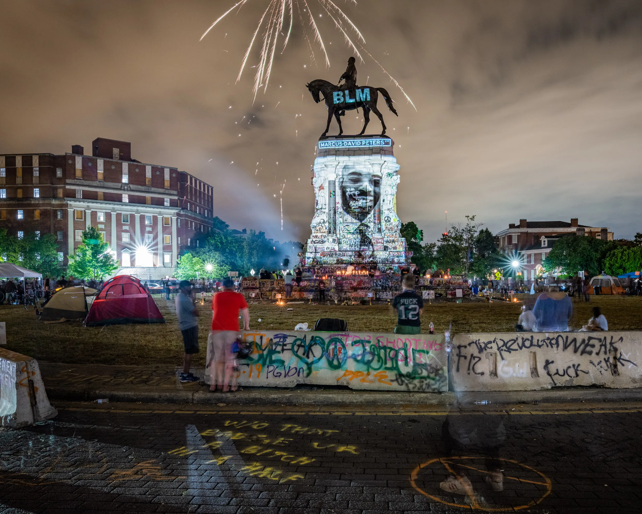 The header image of my 24-page article in the February 2021 issue of National Geographic Magazine. 

During protests against police brutality last June in Richmond, Virginia, the defaced statue of Confederate General Robert E. Lee became the site of mass graffiti and illuminated imagery. The projections, organized by Videometry, are ever changing, and I caught this moment one late night.

Image size: 2500 x 2000

The first collector will receive a signed copy of the magazine. 
