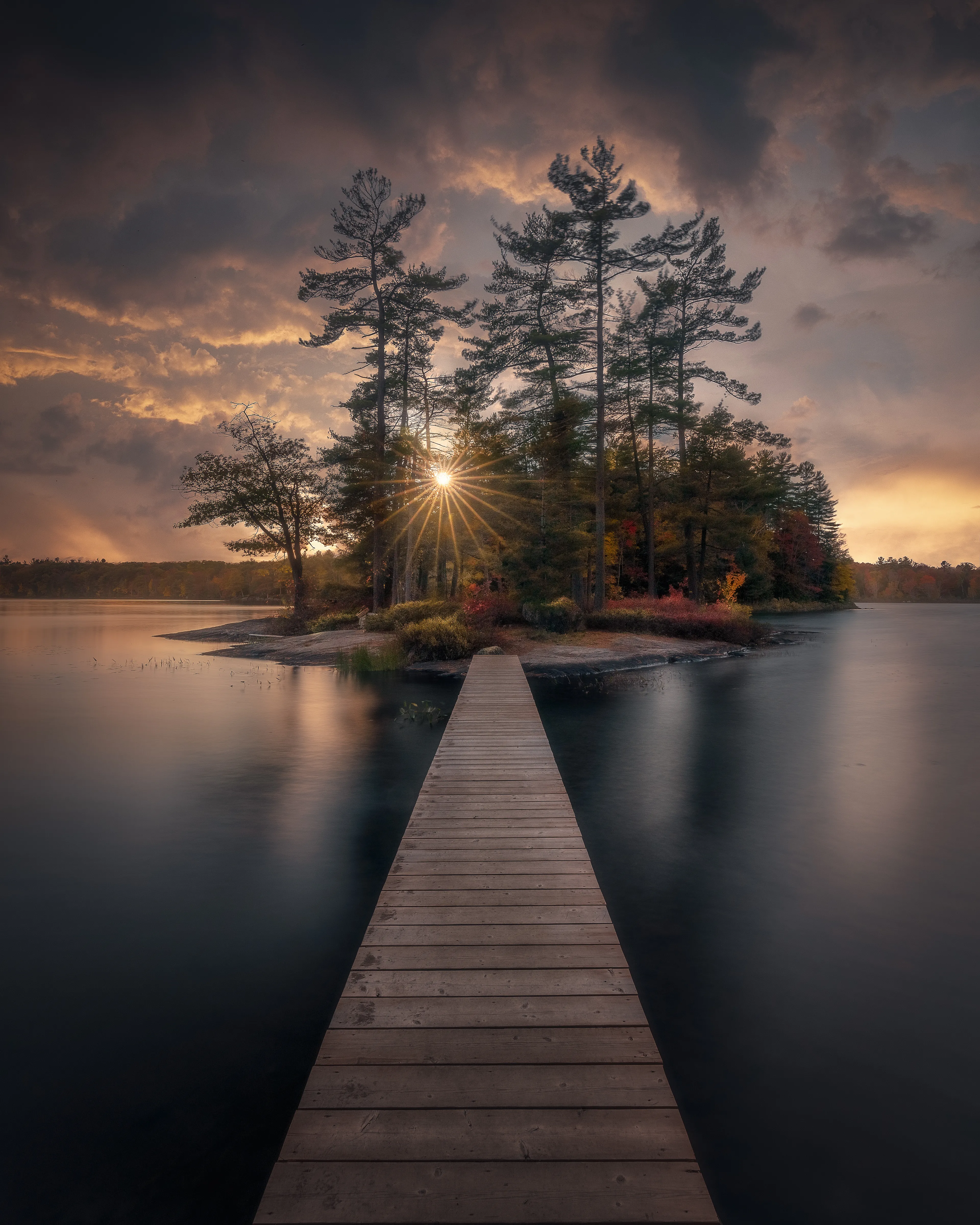 "Into the Wild" is an image I created from an autumn sunset in Muskoka, Ontario. This is a time-blended image made from short and long exposures, shot over the course of an hour at this location. It is a piece that pushed my technical abilities in the field and in post-processing, and will always be a personal favourite of mine. 