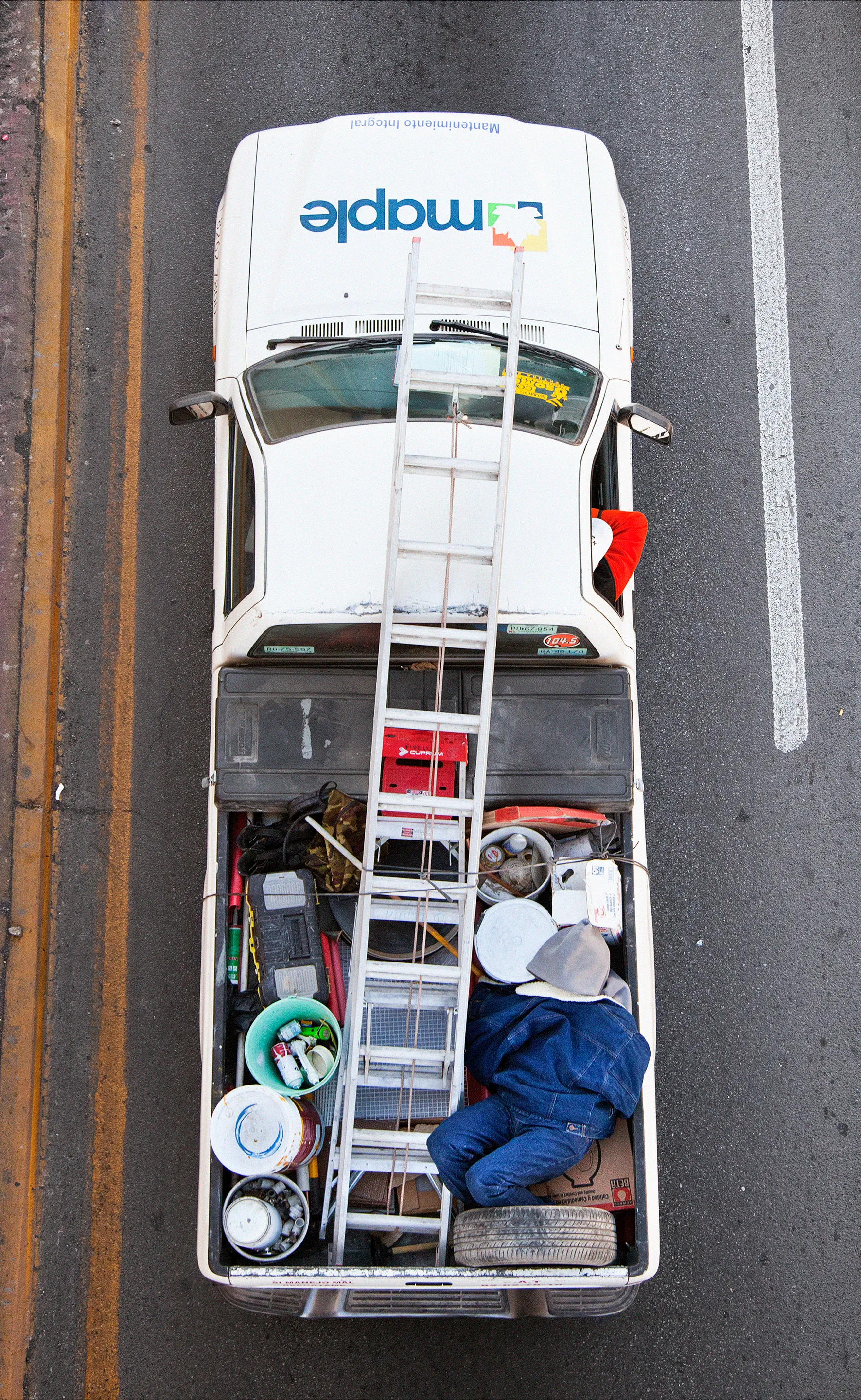 This photograph is part of my series, Carpoolers, which depicts laborers in México captured from an overpass, commuting between distant suburbs and urban centers. Like much of my work, this project comes from a desire to tell the story of the dramatic environmental, economic, and demographic changes playing out in my home city of Monterrey. This series has circulated the internet since 2011 and has been exhibited widely around the world. This piece is part of a collection of 50 works.