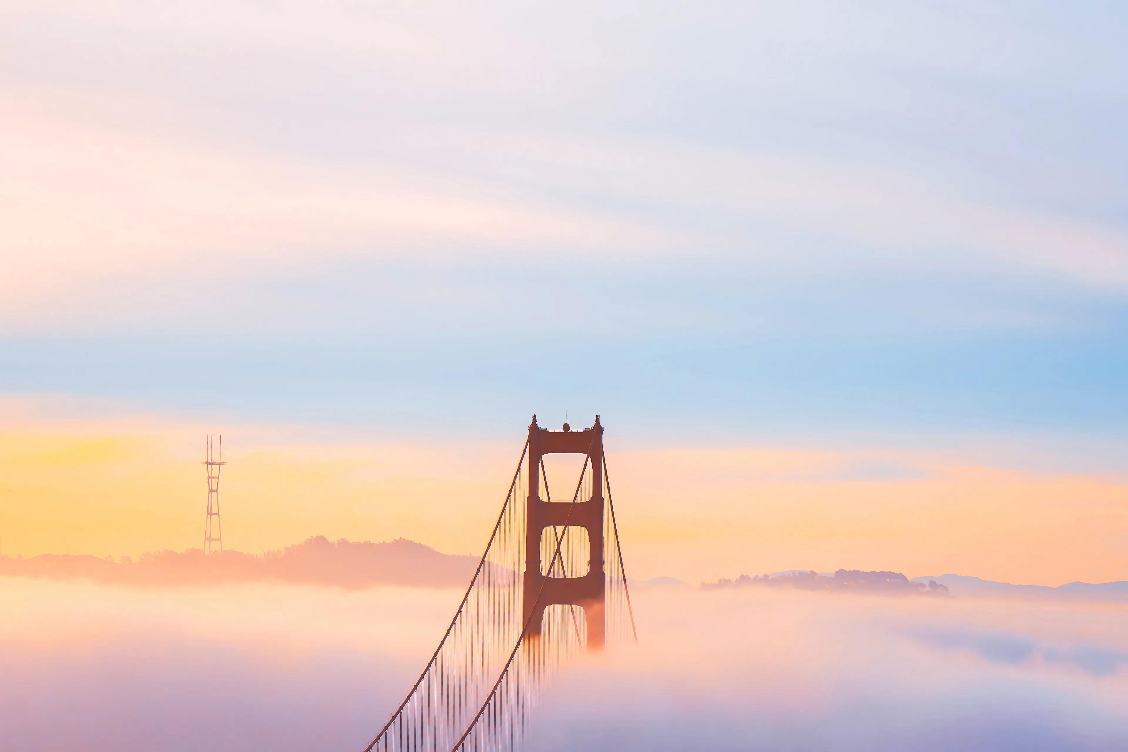 Standing in the cold, windy darkness of the early morning, I didn't know what kind of conditions I would get when the sun came up. This is the risk we take as photographers. In order to get the shot, we need put ourselves in the right place, just in case we get lucky.

As the sun came up, the sky absolutely exploded with color. The signature San Francisco fog rolling in from the Pacific, blanketing the iconic bridge. I was thrilled to capture one of my bucket list shots, "Beyond the Fog".