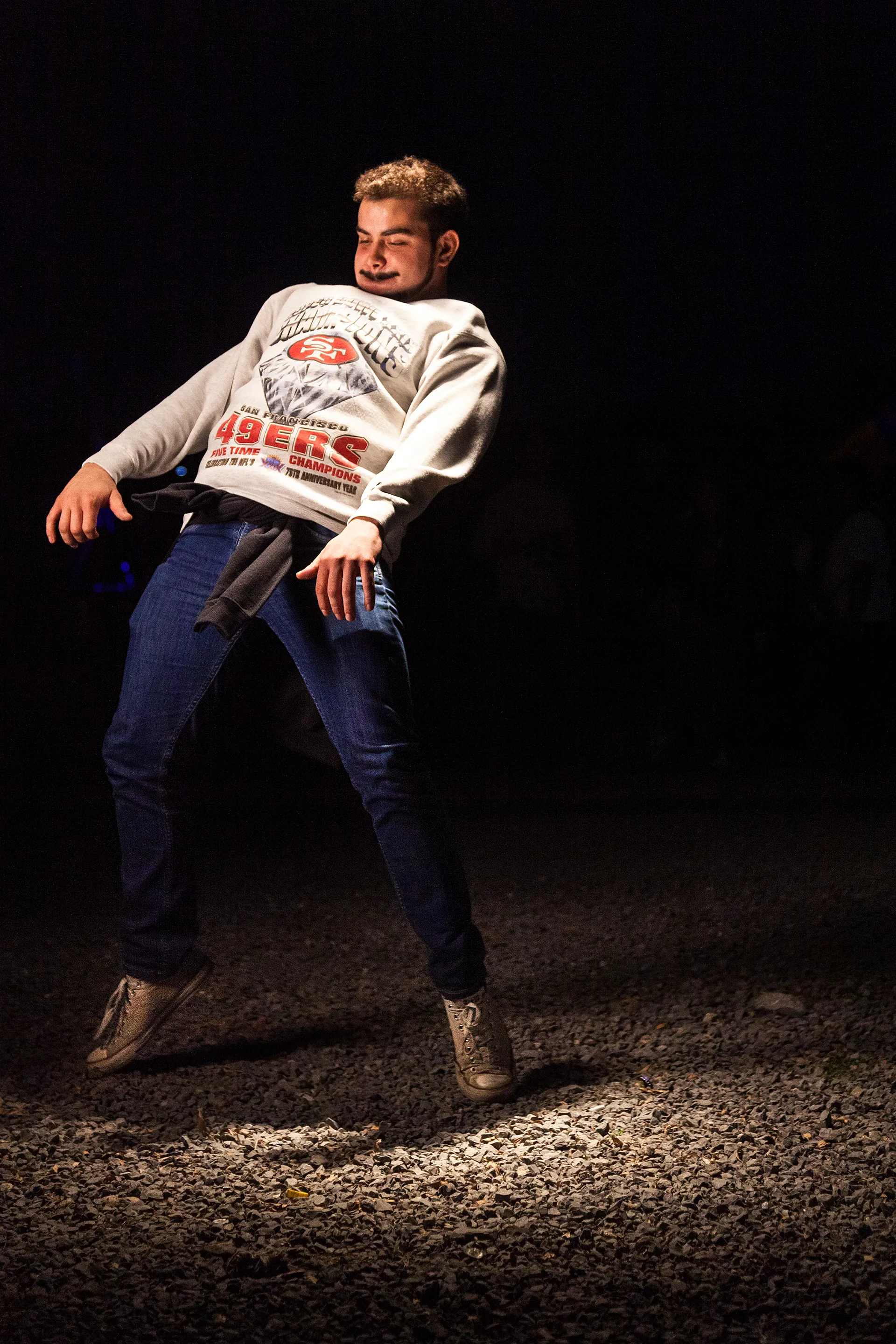 In 2014, I documented the blissful moments of people and crowds in the middle of a live music concert. I wanted to feel their bliss. In retrospect, these are a self-portrait of someone I wanted to be: young, excited, and free. I asked the dancers to dance as if no one was watching to a tune in their heads. Now, in 2021, what I captured in these images feels like a time long passed—a time where we all were experiencing bliss. The 21 pieces that make up The Bliss Project are a symbolic gesture to portray our lives before the pandemic and to project optimism about the future.