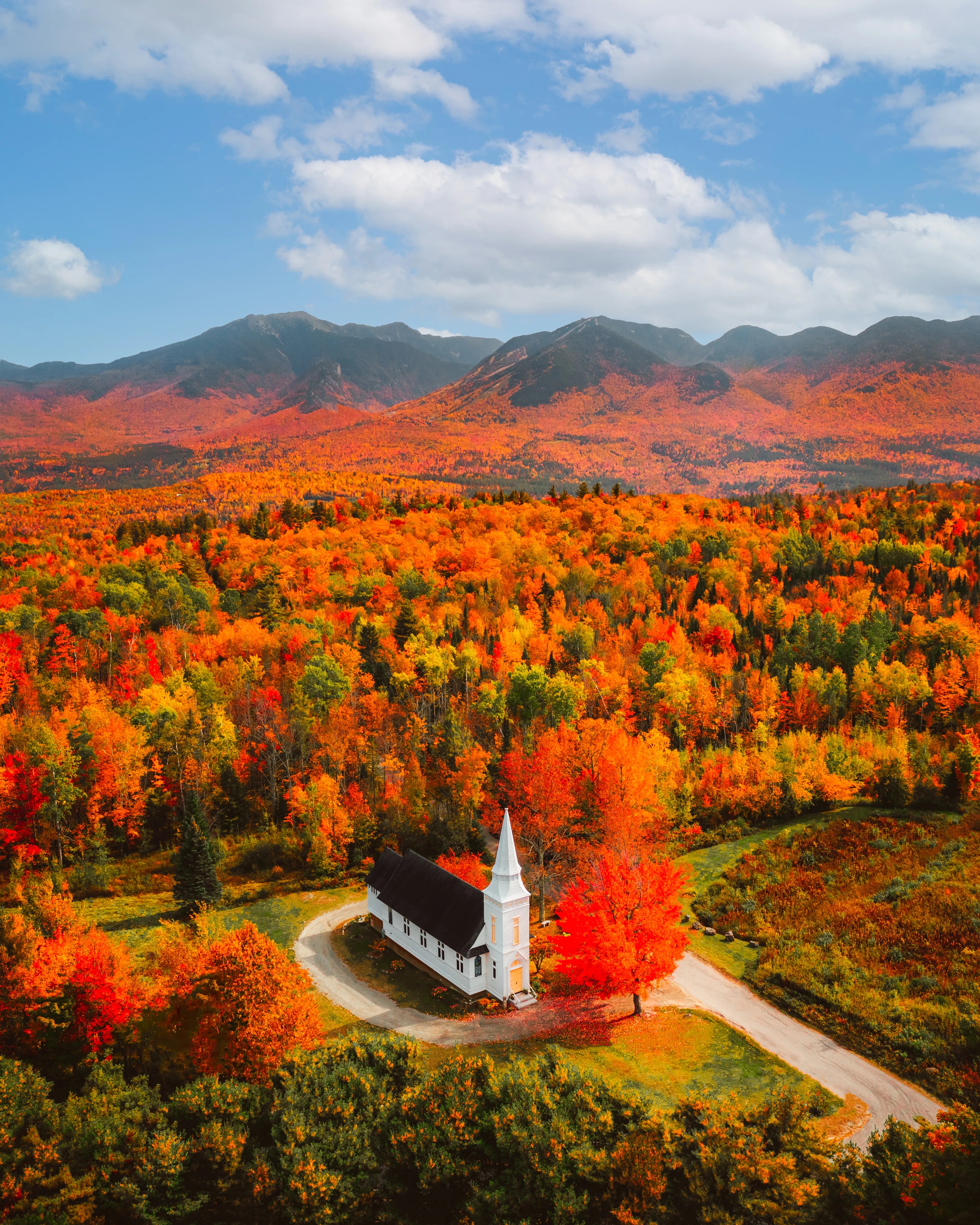 Just outside the mountains, lies a church surrounded by a sea of color. 

A white steeple protruding over waves of red, yellow, and orange.

The wind blows and the autumn leaves rustle, falling to the church steps below. Intermittent cars pass up and down the neighboring dirt road.

The shadows stretch as the sun moves across the sky, the day passing by.

~

I’ve frequently envisioned a scene such as this one in my mind. A masterpiece by Mother Nature crossed with my own imagination.

Using photography as a tool to express my creative vision is something I will forever be passionate about. This is my art.