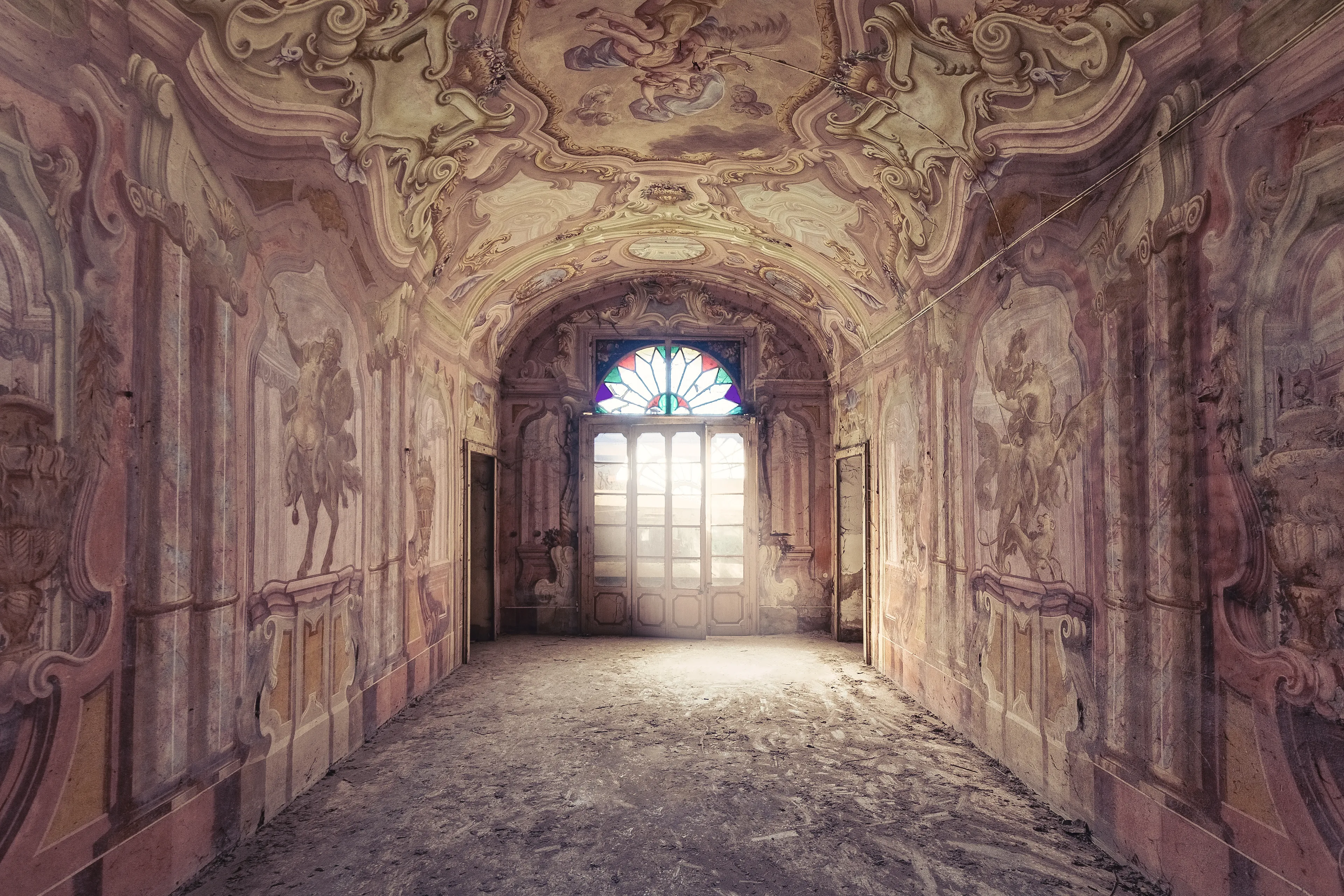 Italy the land of secret beauties...

I remember when I was standing in front of this abandoned country estate. At first glance it seemed to be nothing special. Here of there are some, from the time of the landowners. And actually, at first there was nothing extraordinary, until I stood in the entrance area and my jaw dropped.
An entrance area like a cathedral. Hand-painted with Christian and ancient motifs. 
You might think it's crazy that something like this is left to decay, but Italy has the problem that they have so many cultural assets that it is not even possible to preserve them all. 
Here I come into play to at least preserve the memory of a once glorious time.

