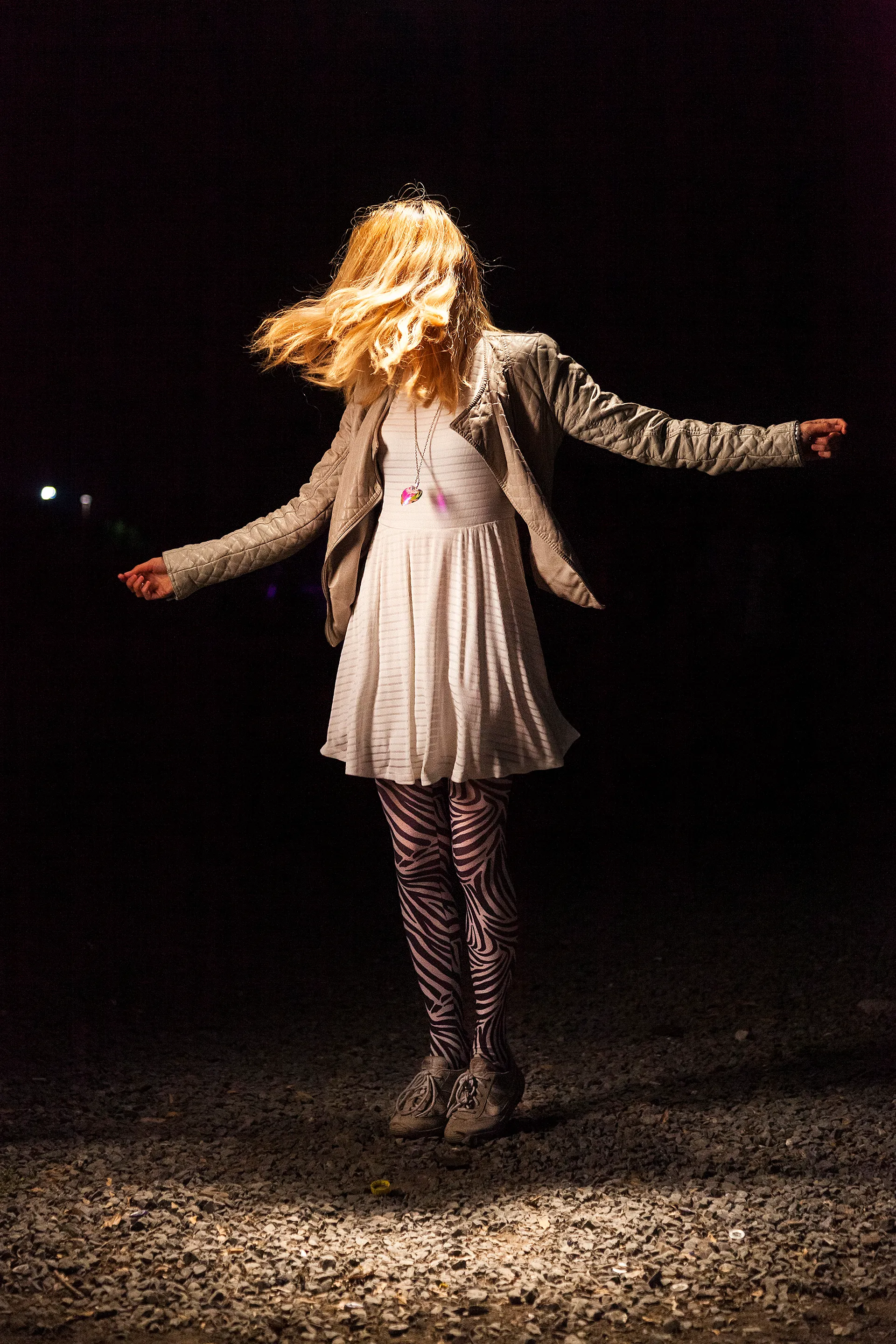 In 2014, I documented the blissful moments of people and crowds in the middle of a live music concert. I wanted to feel their bliss. In retrospect, these are a self-portrait of someone I wanted to be: young, excited, and free. I asked the dancers to dance as if no one was watching to a tune in their heads. Now, in 2021, what I captured in these images feels like a time long passed—a time where we all were experiencing bliss. The 21 pieces that make up The Bliss Project are a symbolic gesture to portray our lives before the pandemic and to project optimism about the future.