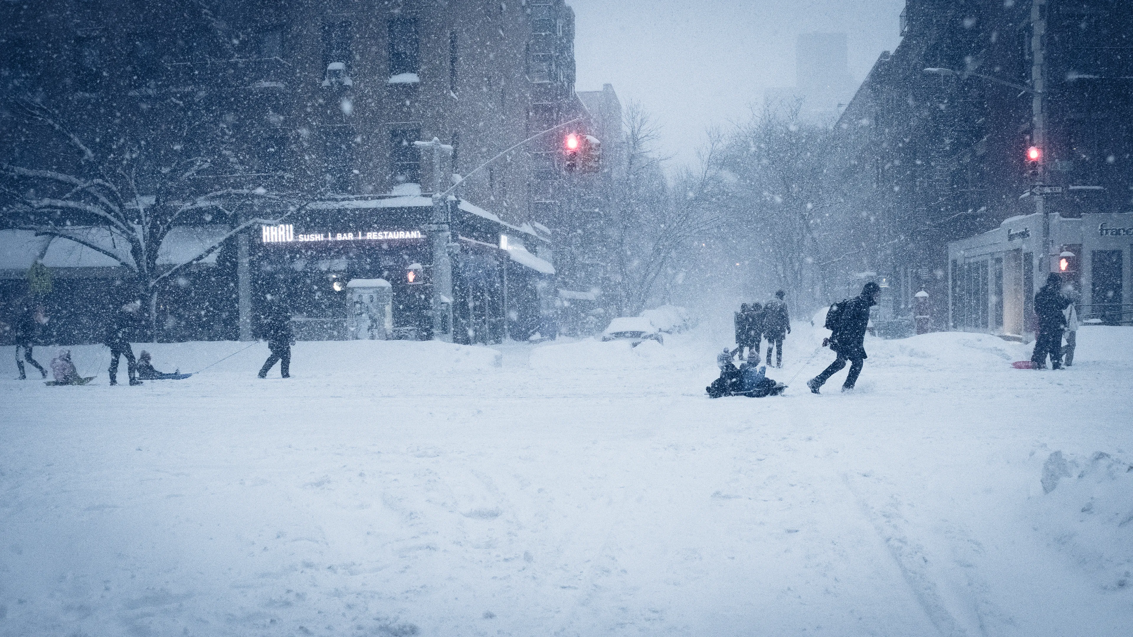 "Snow Days In NYC" is a collection of images that were taken over the course of 6 years. Each image documents an everyday New Yorker bravely making their way through the storm as the winds whip snow into their faces. Each step taken is calculated. One misstep could lead to having a speedy and painful introduction to the pavement.