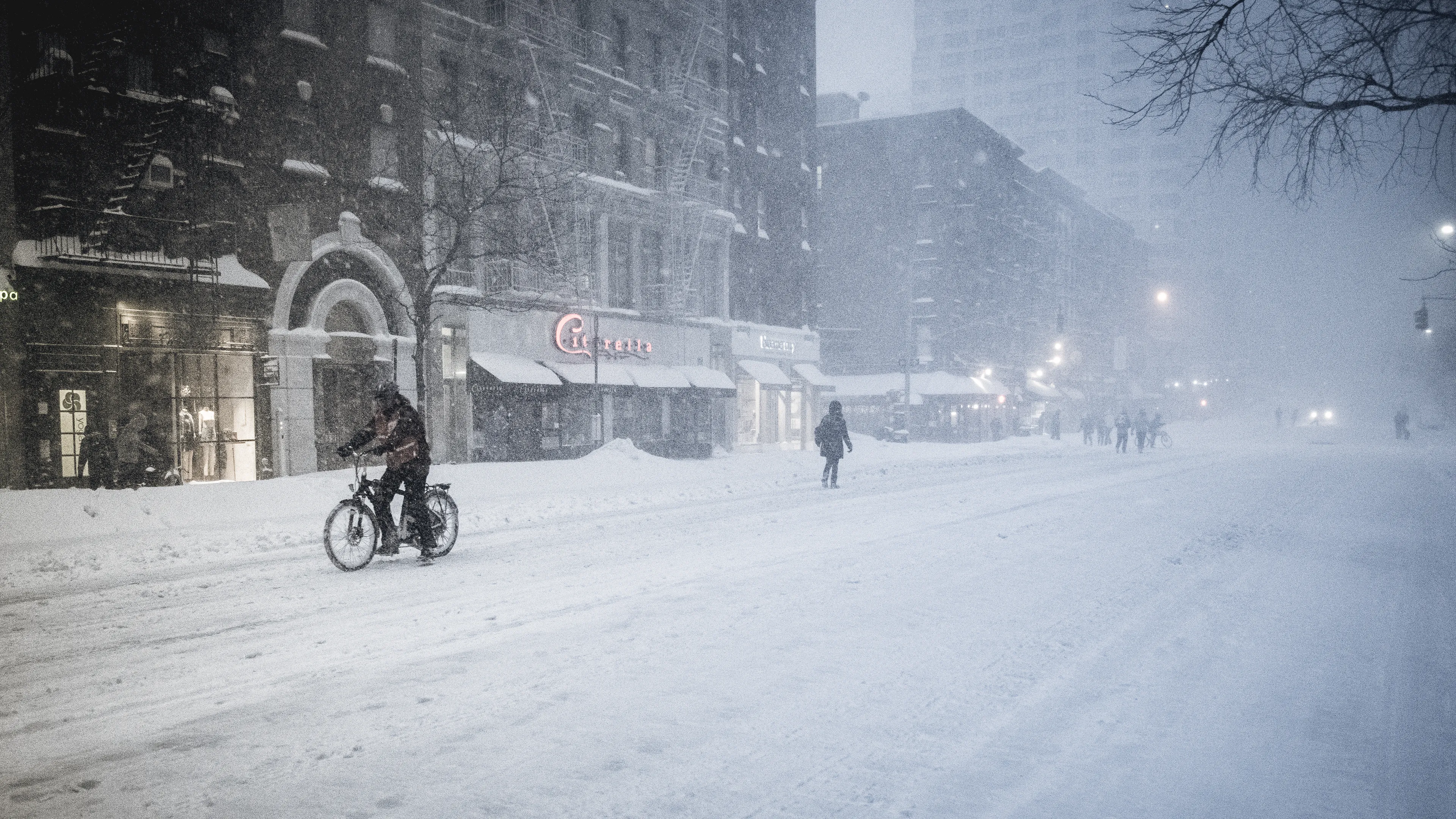 "Snow Days In NYC" is a collection of images that were taken over the course of 6 years. Each image documents an everyday New Yorker bravely making their way through the storm as the winds whip snow into their faces. Each step taken is calculated. One misstep could lead to having a speedy and painful introduction to the pavement.