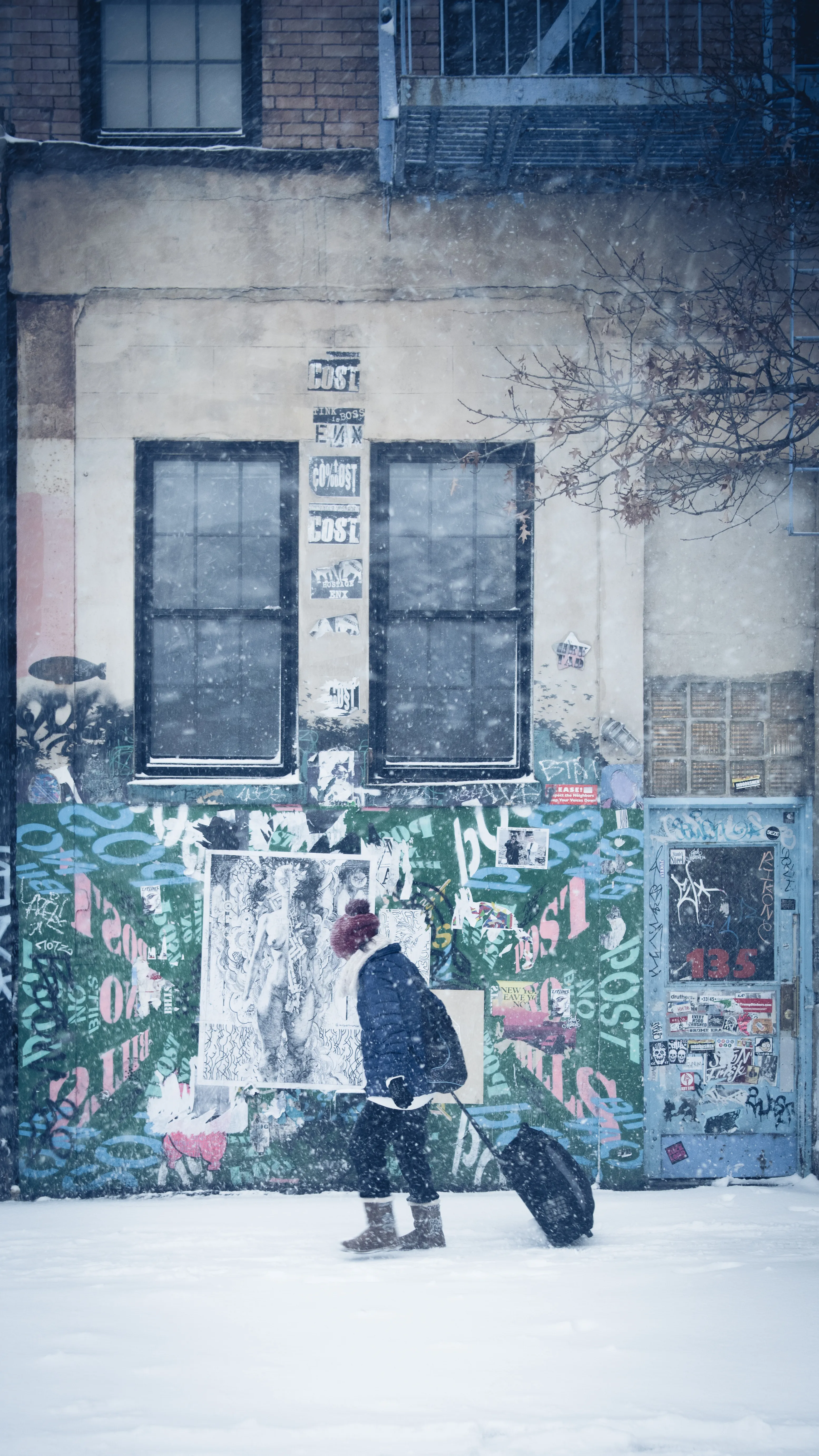 "Snow Days In NYC" is a collection of images that were taken over the course of 6 years. Each image documents an everyday New Yorker bravely making their way through the storm as the winds whip snow into their faces. Each step taken is calculated. One misstep could lead to having a speedy and painful introduction to the pavement.