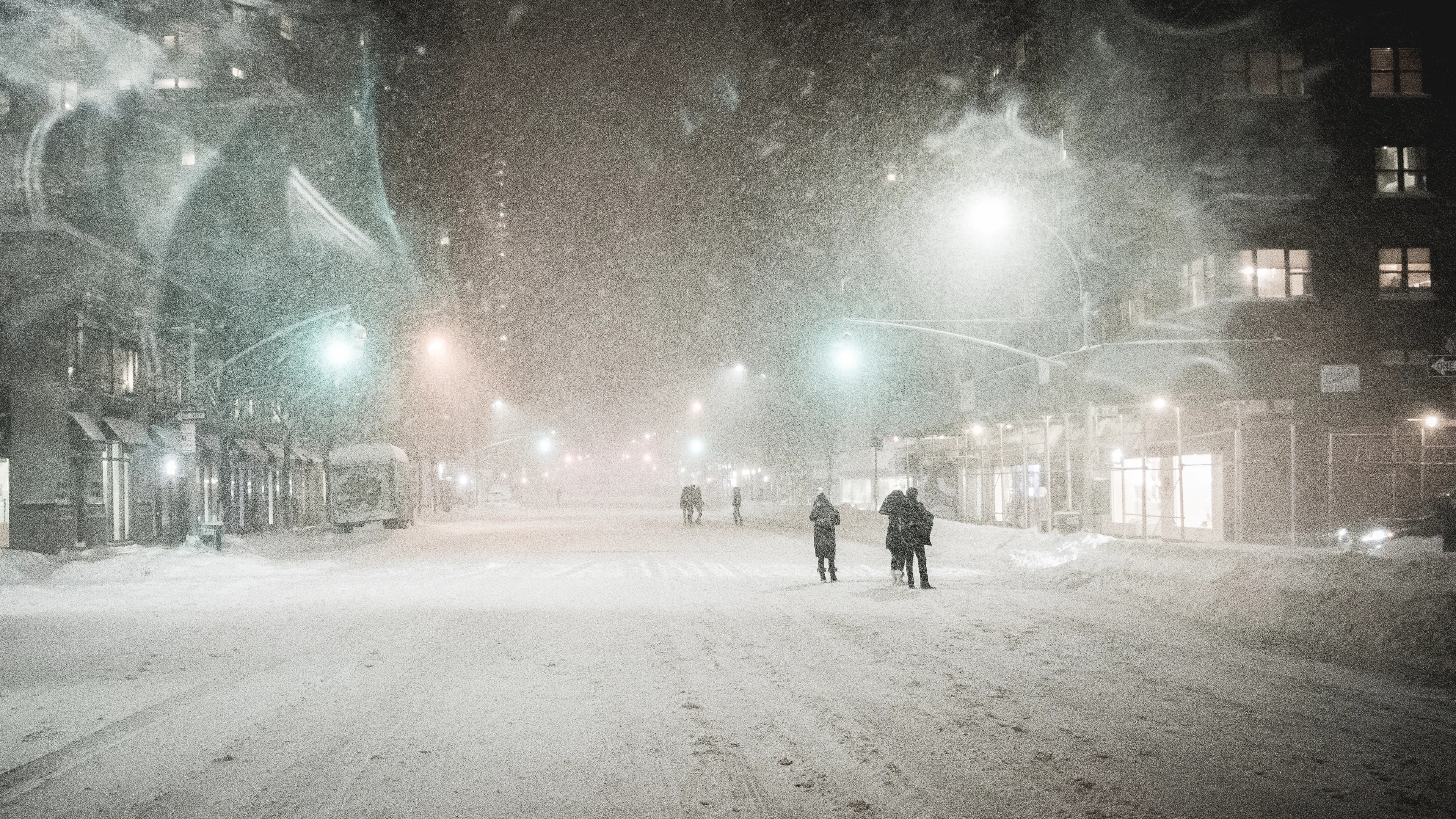 "Snow Days In NYC" is a collection of images that were taken over the course of 6 years. Each image documents an everyday New Yorker bravely making their way through the storm as the winds whip snow into their faces. Each step taken is calculated. One misstep could lead to having a speedy and painful introduction to the pavement.