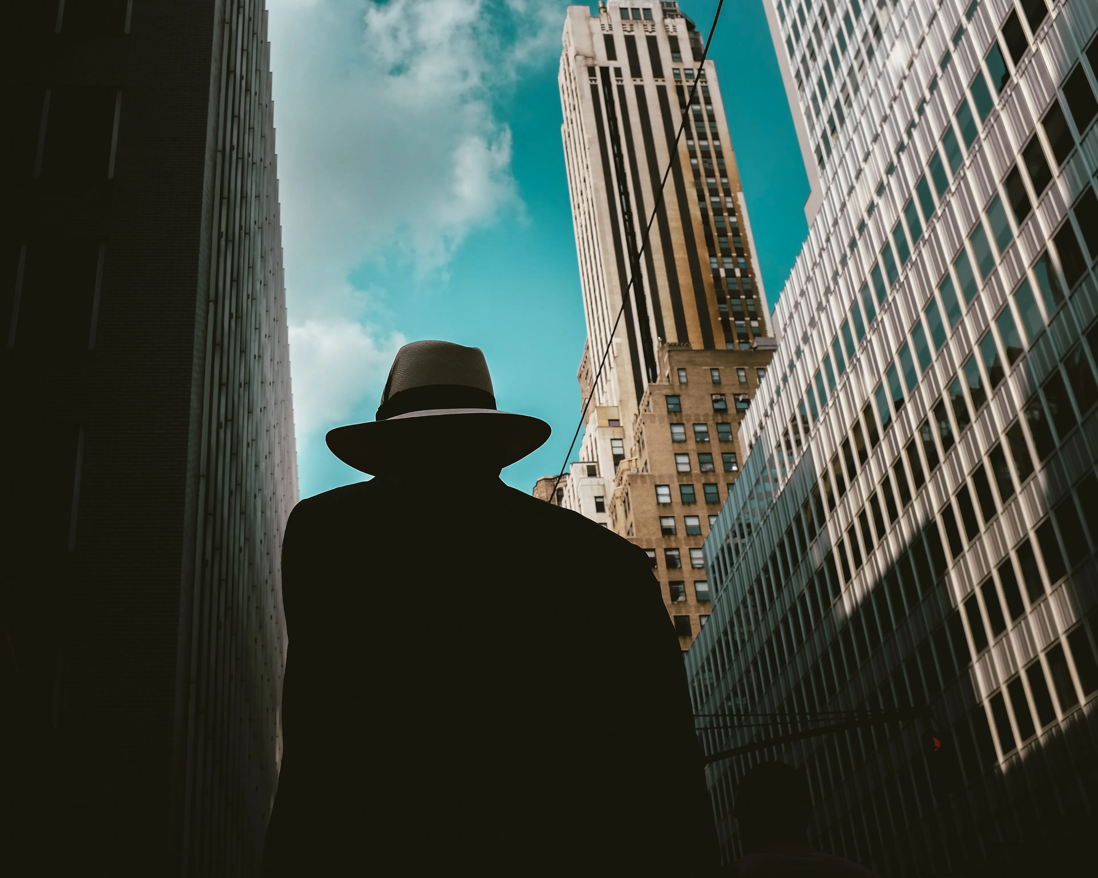 Fedora:
July 21, 2014

City:
“You ask too many questions!”

An expression I heard all too often when I was a child. My curiosity and eagerness to absorb the world around me seemed to annoy the adults in my life. Perhaps they were right, and I was indeed annoying. But the thing is that curiosity never left me, and still today I’m left with more questions than answers when I look around. 

My camera has become the repository of the questions, riddles, and enigmas of my life. My photographs are an estuary where thoughts meet observations in the quest for answers. The city, the streets, and the people are my richest source of wisdom. Strangers’ stories enter through my lens and jump-start my neural network into overdrive. 

Occasionally, I open the valve and release them back into the world to relieve the pressure they build in my mind.