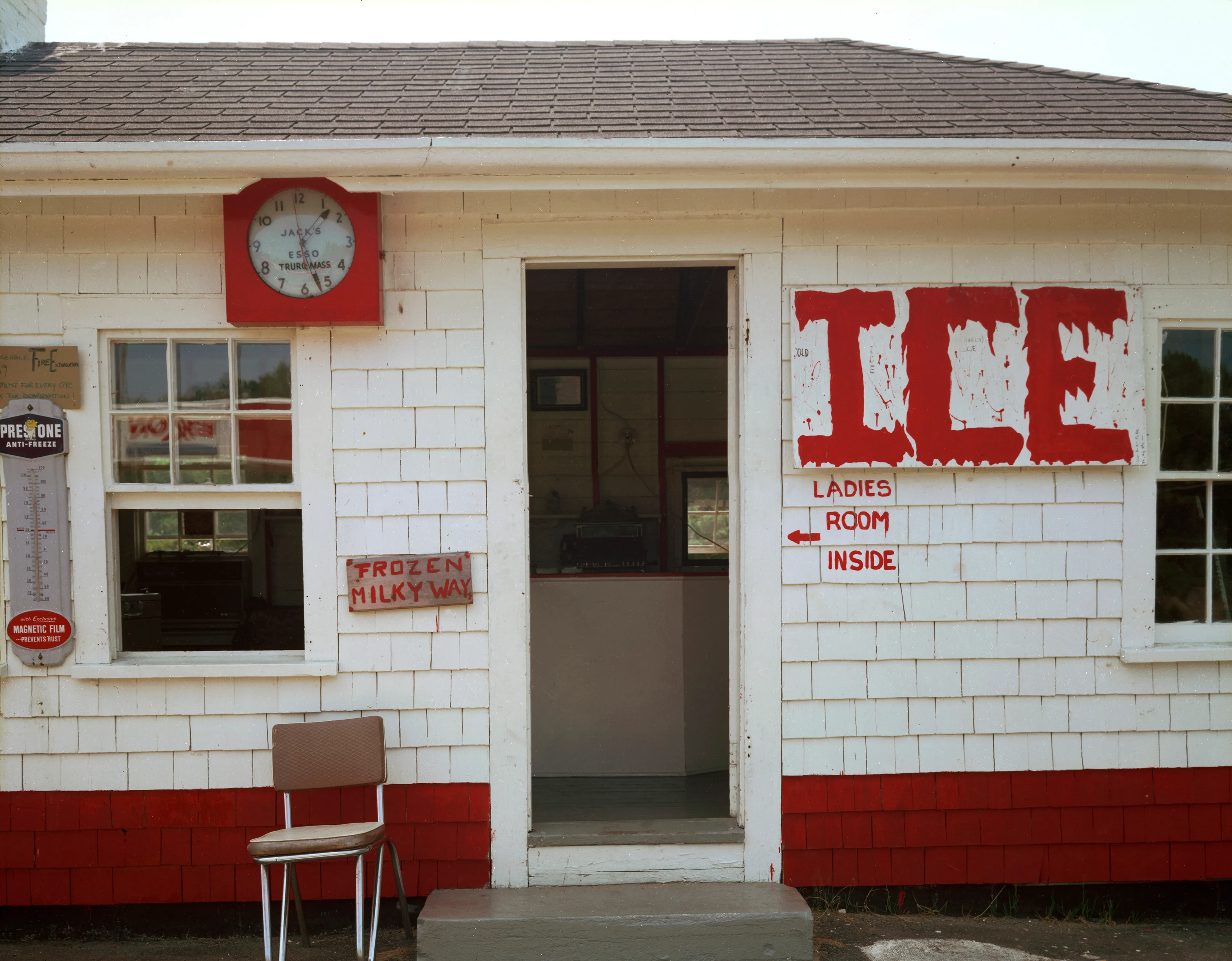 July 28, 1976: Jack’s Esso Truro ice, This was the gas station that Edward Hopper painted.

"I took myself off to Provincetown on Cape Cod so I could summer with my family, and learn how to see in 8x10, in which the image is upside down and reversed, while beginning to learn to use Time in seconds, rather than in 1000th of a second. Well, Cape Cod is not 5th Avenue, but the light out there on that 60-mile-long sandbar in the Atlantic is unlike light on the mainland. Every molecule of moisture refracts light like a prism; while on the mainland there is a particle of dirt in every drop of atmosphere. Once I recognized that, then everything changed. Light, in all its intensity and tone, became my subject. Just as in 35mm, you can only photograph where you are and what you see there." - Joel Meyerowitz.

Edition: 1 of 1