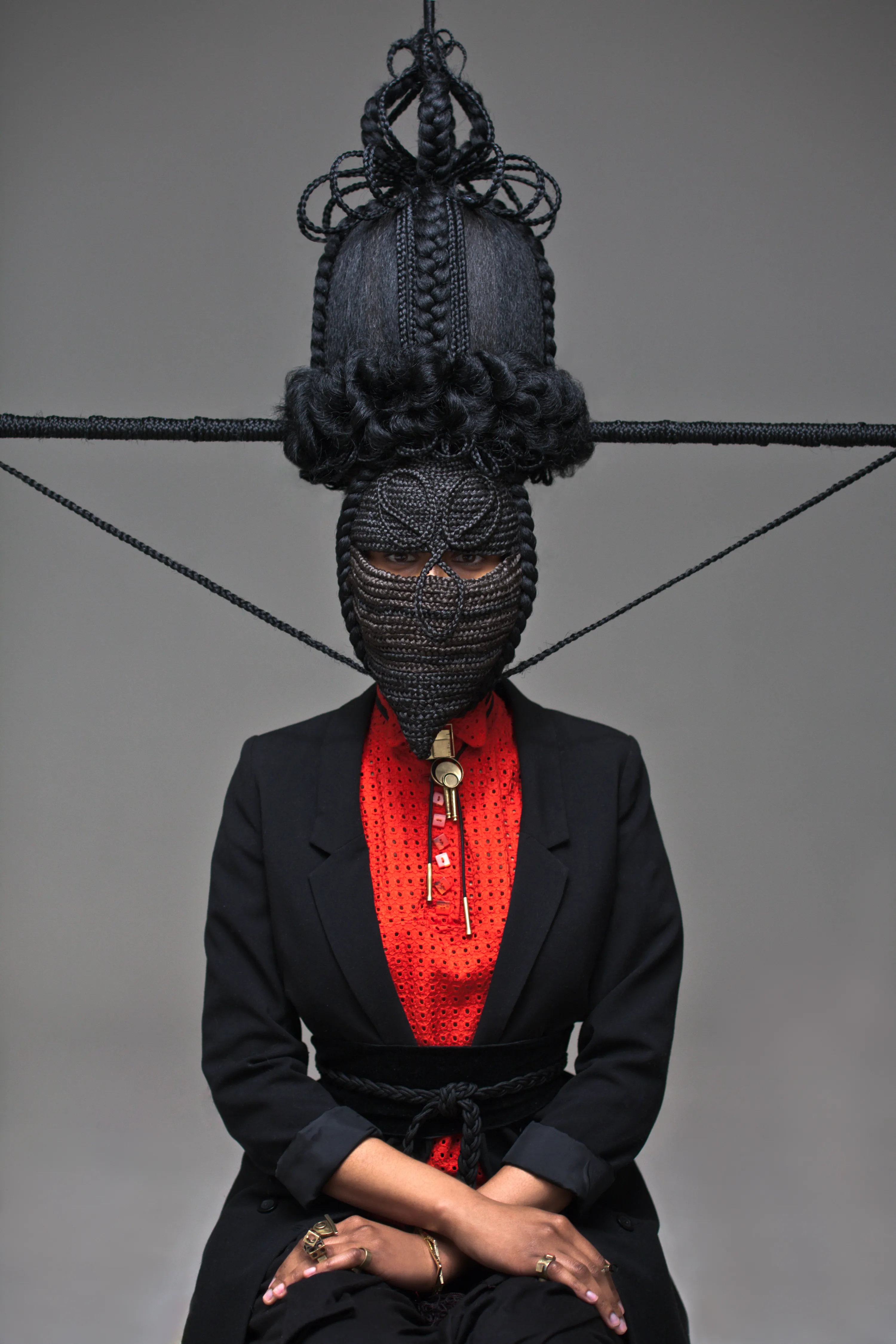 For centuries, the art world was seen through the eyes of a small few who, under a patriarchal society, chose the aesthetic and the narrative—and whose main depiction of the sacred female body was as an objectified and sexualized woman. 

Delphine Diallo aims to change this dynamic. Her intention is for every woman she photographs to feel the image she makes of them is a personal gift. “I am not taking pictures, I am giving pictures,” as Diallo puts it. By engaging in intimate conversations with her subjects, Delphine removes the sense of vulnerability that often comes with being photographed. Working with body painters and jewelry and mask makers, Diallo also uses traditional mythology and spiritual symbols to empower her subjects. Her portraiture is all about connection and exchange. She believes women are deep beings and connects with them on an emotional level. The French-Senegalese photographer spends more time speaking with her subjects than photographing them. 

Diallo’s photographs are never discriminating, yet deeply communicative, and portray women beyond judgment, soaking up their limitless beauty. Diallo's works are meant to encourage every woman to write a personal narrative, to take a stand, to have a firm voice. No preparatory models, sketches, or plans lay behind her photographs, which depict only outstanding feminine painted bodies. It is all a part of the vision flowing out of the artist's mind, grounded in her right brain hemisphere, predominant in her energetic and vibrant personality. 

Drawing elements from eastern mythology and philosophy, whilst always ennobling and empowering women, her practice is reminiscent of Oriental 19th-century painting. Looking at Krishnamurti, Frantz Fanon, Joseph Campbell, Bruce Lee, Aimé Césaire, and A.D. Wilson as deep inspirational sources, her photographs raise awareness, appealing to all women to awaken their senses. Diallo immerses herself in the realm of the feminine universe and her eloquent portraiture technique unveils and stirs unexplored emotion and insight meant to reach beyond appearances. 

“We are in constant search for wonder and growth. I see art as a vessel to express consciousness and as an access to diffuse wisdom, enlightenment, fear, beauty, ugliness, mystery, faith, strength, fearlessness, and universal matter”.

Artist: Delphine Diallo
Series: Highness
Date: 2011