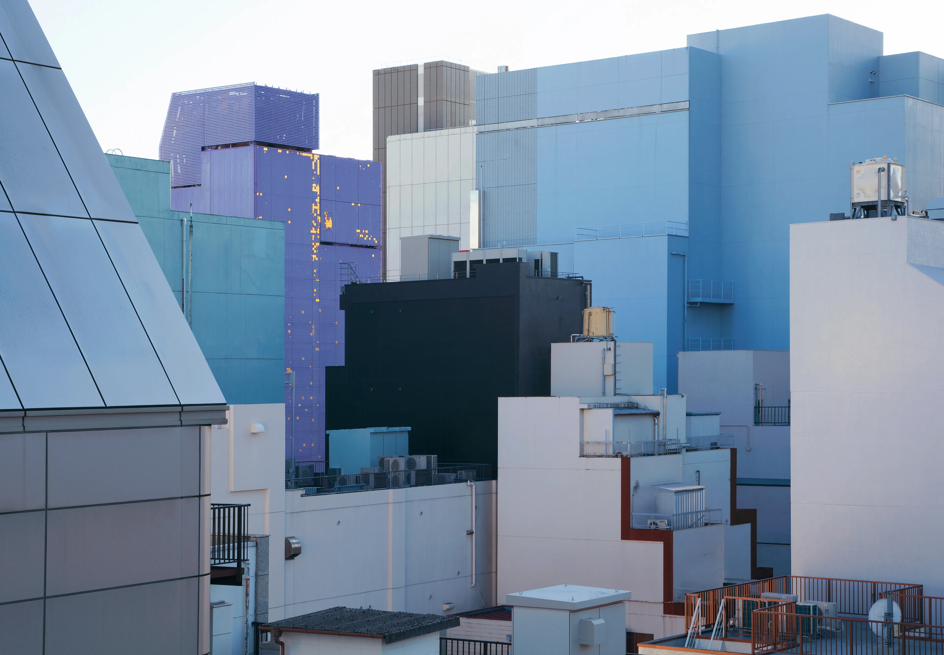 Tokyo Nude confronts the ever-changing outlines of the metropolis. As we discard the garments of civilization, is this dystopia or utopia?

Tokyo exists in a state of continuous renewal. The crowded buildings almost feel like forms deeply rooted forms, cemented into the city's fabric. Living in Tokyo, I exist symbiotically with these rigid forms. Conversely, the sense of community between people seems to be shifting into places unseen in public; mainly the Internet. Virtual connections have become more important than physical relationships with neighbors, thus shifting the historic ideals of "real life."

The outlines of Tokyo have become blurred. These works deal with my wonder for what this metropolis will look like when we no longer desire material functions. There are no entrances, no exits; a world filled with rectangular structures working their way into the horizon. All activity happens within the structures, and traces of consumption disappear from public view; a discarding of civilization's ideals, the garments and decorations.