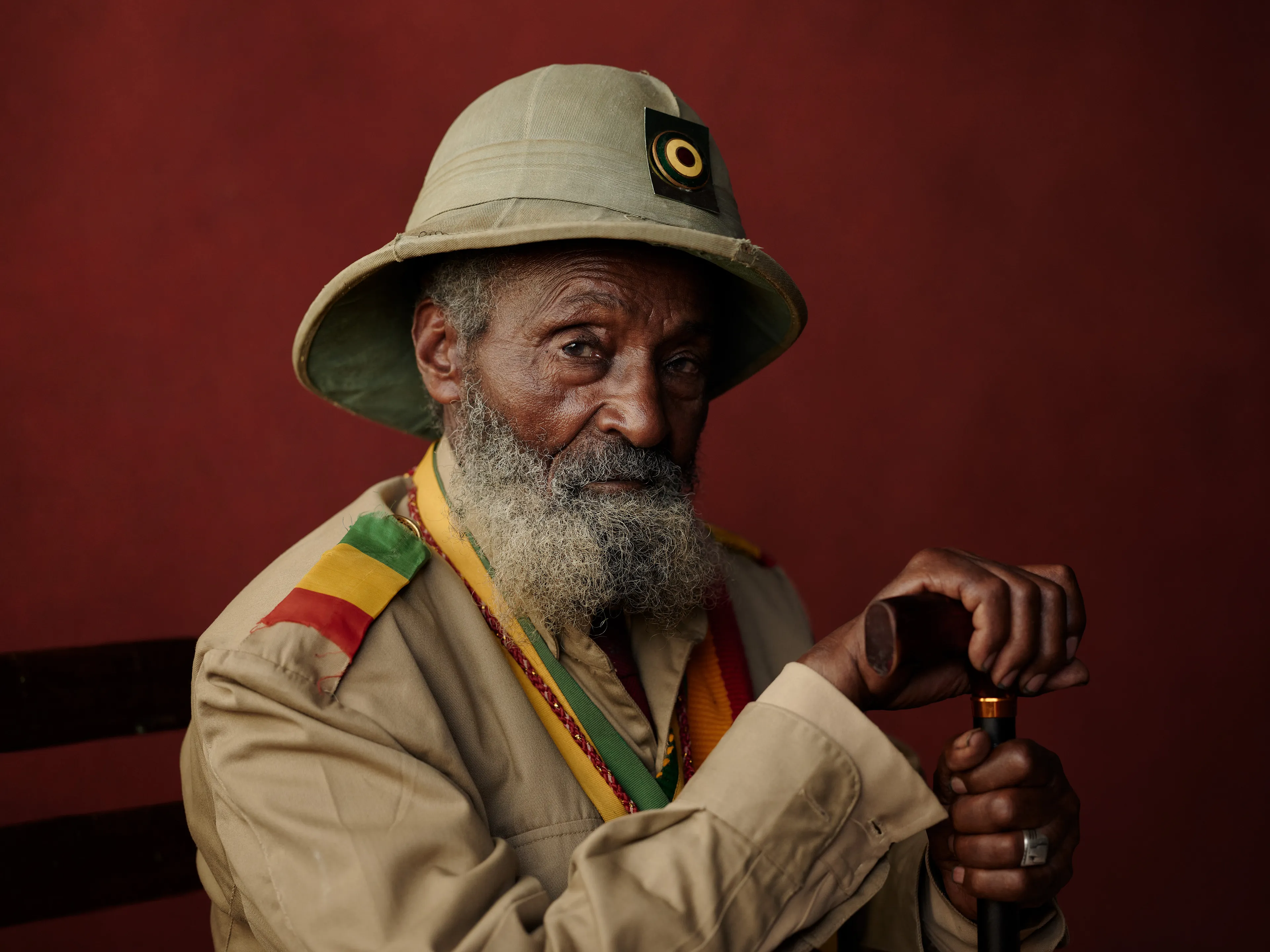 Joey L. returns to Quantum with Ethiopia - Portraits: a collection directly linked to his genesis drop during Season 1. For every environmental image from Joey’s first drop, there is a portrait companion.

“For years, we dragged our nomadic studio tent across almost every region of Ethiopia. In our tent, everyone was equal. We captured pure magic. Every kind of person entered and had their portrait taken. The tent was our little fantasy world. It was the Ethiopia that we dreamed of, even when the reality outside of it was sometimes stricken with searing pain. Each portrait was a tribute to a distinct region of the country. Disconnected cultural threads were woven together in a cohesive visual style in order to truly see Ethiopia— which itself is a modern nation state, but is also the sum of all the diverse people who inhabit it.”

Joey’s portraits alternating on red and black backdrops are the visual backbone of my forthcoming book “Ethiopia” (Insight Editions, January 2023), which compiles 13 years of work.

The tent itself is a metal frame modified with diffusion material made out of netela fabric, which is a hand-spun cotton perfected by Dorze craftspeople. Every portrait is created with natural light molded from the tent itself and photographed on location.

Addis Ababa, Ethiopia 
March 2021