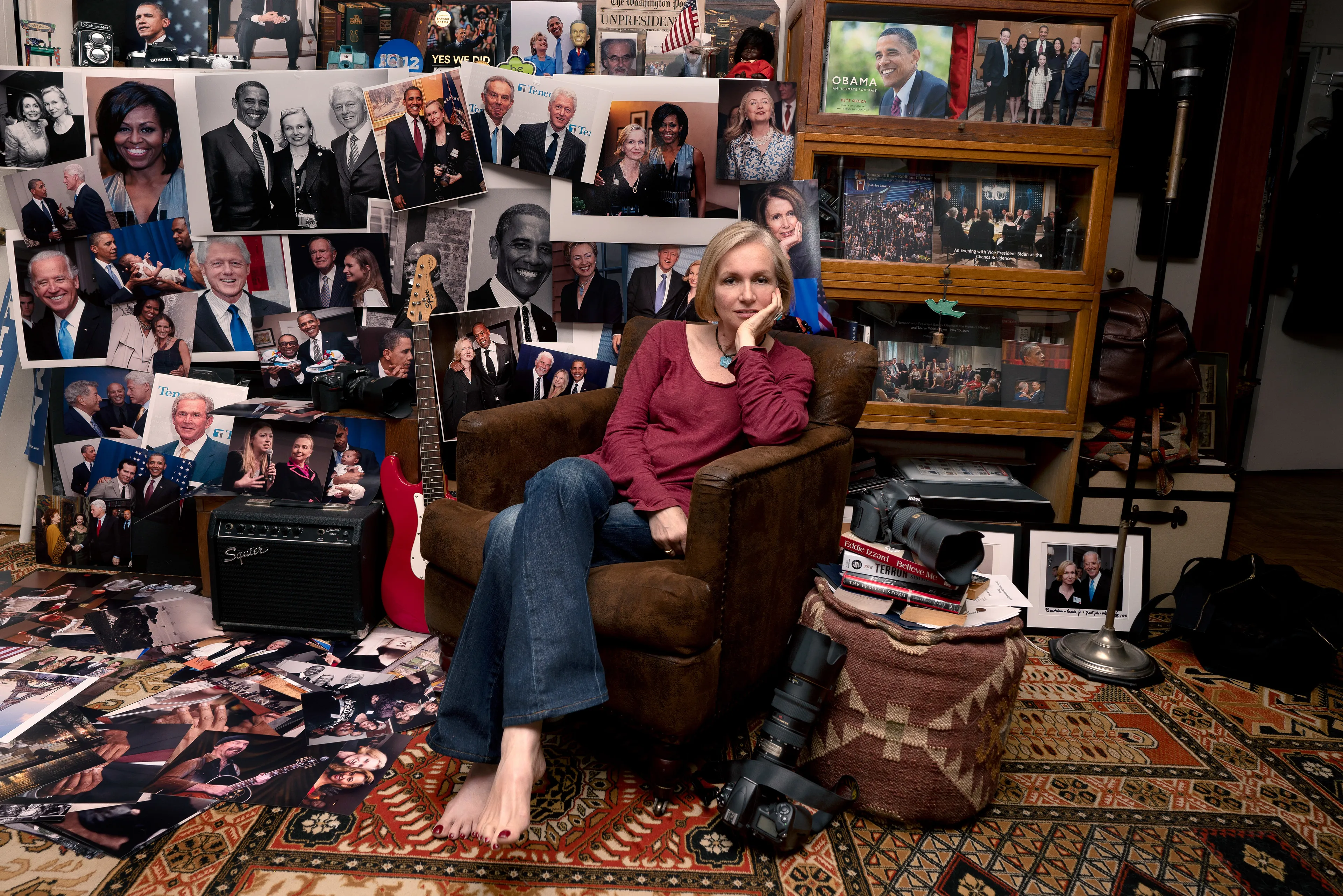 For the past 30 years, Sally Davies has been documenting the streets of Manhattan. She’s watched neighborhoods negotiate with gentrification, post-9/11 anxiety, economic uncertainty, and a steady stream of “if I can make it there, I’ll make it anywhere” optimism. Davies has taken memorable photographs of ordinary doorways, wet curbs and corners, the glow of bar-grill signs, bodegas, bakery windows, wheelchairs on rooftops, incoming weather, graffiti, and vintage cars. As she has said, “You either fall in love with moonlight on a garbage bag or you hate it and move along.”*

Davies started the New Yorkers by shifting from her usual view of the urban outdoors to the idea of chronicling the spaces and stories of the natives and transplants who give the city its particular vitality. 

In these portraits, you will meet waitresses, musicians, cab drivers, painters, teachers, shopkeepers, writers, designers, producers, parents, a gossip columnist, and a psychic to the stars, among others. They are singularly sensational, and they attest to multiple jobs, friendships, marriages, divorces, children, and pets. Young and old, straight and gay, casual and formal; they pose in cramped kitchens and elegant living rooms, laying on beds, sitting in bathtubs, surrounded by the surfaces and souvenirs of living. There is an abundance of brick, wood, leather, and metal, and collections of refrigerator magnets, religious and street art, books, Pez dispensers, vinyl records, and plants.

These photographs and texts speak to what all New Yorkers understand—to live in this city is to embrace struggle, sacrifice, love, and change. When I spoke with Davies over breakfast in February 2020, I asked her what this project reveals. She said, “This is the end of an era.” That comment has returned to me repeatedly. This book went to print during a pandemic that stopped the world as we knew it. We were in our homes for hours on end, adapting to new habits, while thinking and feeling deeply about where and how we live. These New York people were right on time.

by Stuart Horodner
*Sally Davies in Michael Ernest Sweet’s “Photographer Sally Davies Discusses Women Street Photographers,” HuffPost (December 15, 2015) 

Photographed at her home on the Upper East Side on October 25, 2019.