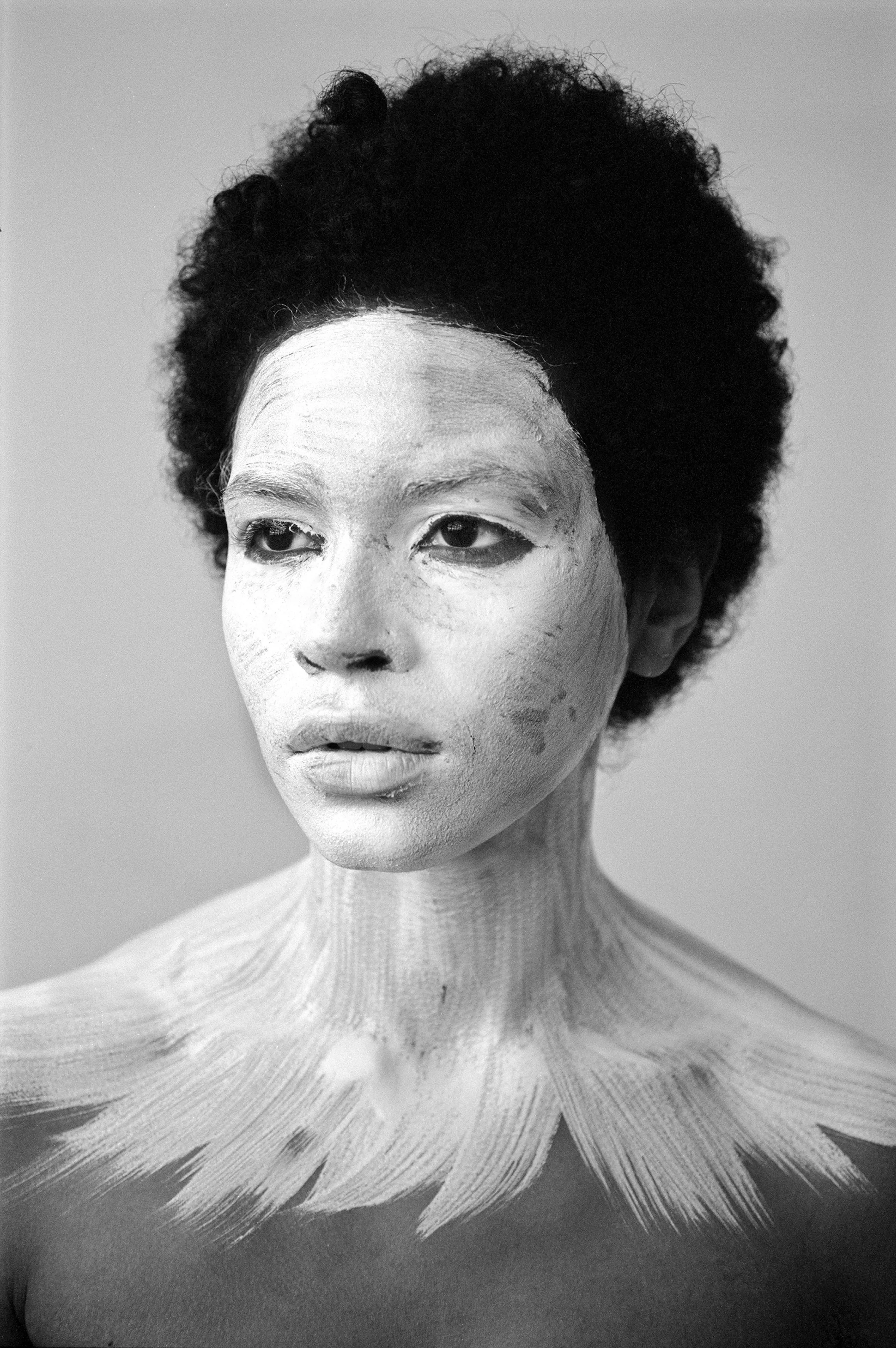 For centuries, the art world was seen through the eyes of a small few who, under a patriarchal society, chose the aesthetic and the narrative—and whose main depiction of the sacred female body was as an objectified and sexualized woman. 

Delphine Diallo aims to change this dynamic. Her intention is for every woman she photographs to feel the image she makes of them is a personal gift. “I am not taking pictures, I am giving pictures,” as Diallo puts it. By engaging in intimate conversations with her subjects, Delphine removes the sense of vulnerability that often comes with being photographed. Working with body painters and jewelry and mask makers, Diallo also uses traditional mythology and spiritual symbols to empower her subjects. Her portraiture is all about connection and exchange. She believes women are deep beings and connects with them on an emotional level. The French-Senegalese photographer spends more time speaking with her subjects than photographing them. 

Diallo’s photographs are never discriminating, yet deeply communicative, and portray women beyond judgment, soaking up their limitless beauty. Diallo's works are meant to encourage every woman to write a personal narrative, to take a stand, to have a firm voice. No preparatory models, sketches, or plans lay behind her photographs, which depict only outstanding feminine painted bodies. It is all a part of the vision flowing out of the artist's mind, grounded in her right brain hemisphere, predominant in her energetic and vibrant personality. 

Drawing elements from eastern mythology and philosophy, whilst always ennobling and empowering women, her practice is reminiscent of Oriental 19th-century painting. Looking at Krishnamurti, Frantz Fanon, Joseph Campbell, Bruce Lee, Aimé Césaire, and A.D. Wilson as deep inspirational sources, her photographs raise awareness, appealing to all women to awaken their senses. Diallo immerses herself in the realm of the feminine universe and her eloquent portraiture technique unveils and stirs unexplored emotion and insight meant to reach beyond appearances. 

“We are in constant search for wonder and growth. I see art as a vessel to express consciousness and as an access to diffuse wisdom, enlightenment, fear, beauty, ugliness, mystery, faith, strength, fearlessness, and universal matter”.

Yang No. 2