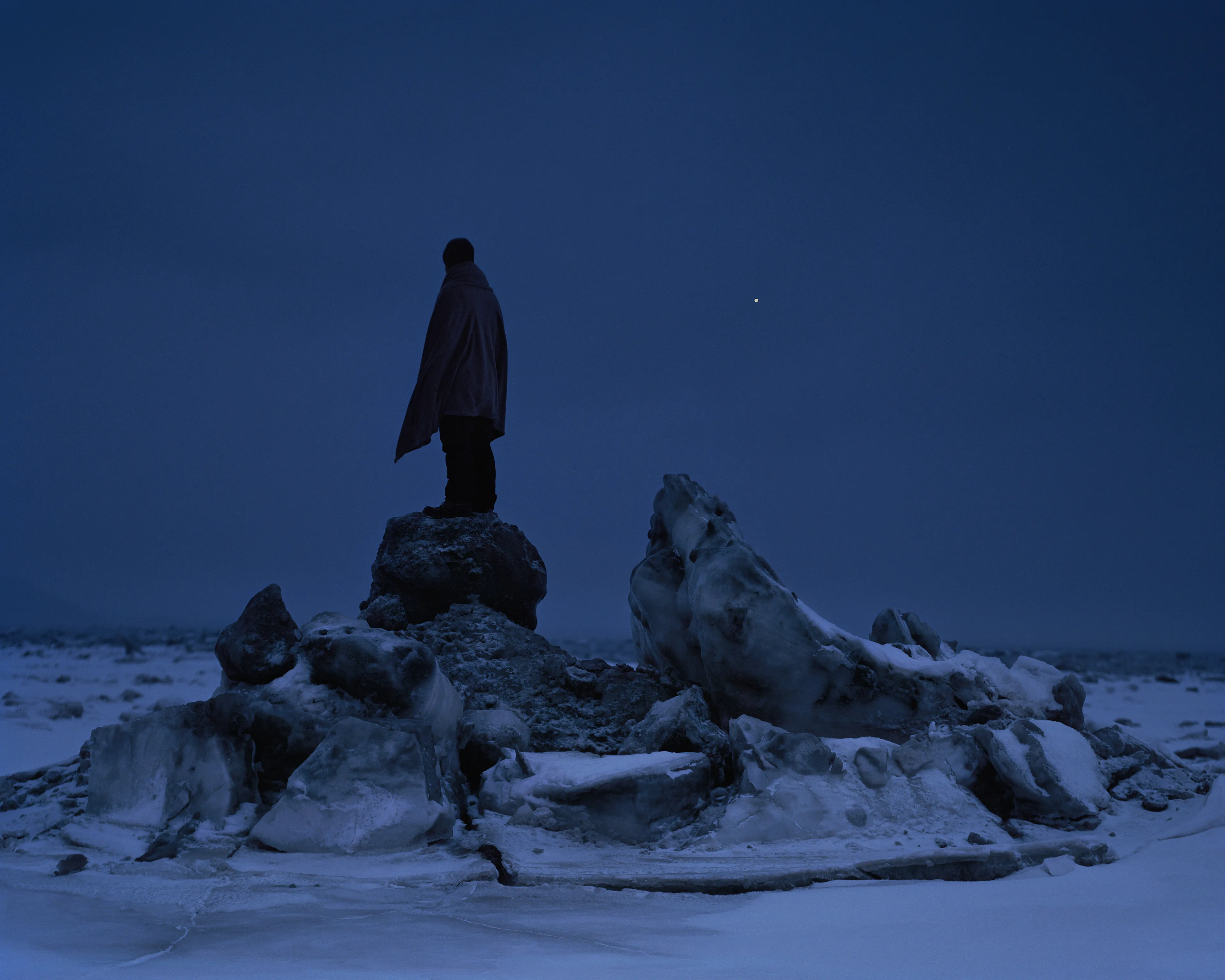 Polaris is a meditation on otherworldly encounters in the Circumpolar Northern landscape. At once an inward and outward exploration, the images reflect my childhood perception of the natural world: a realm of wonder, mystery, and sometimes magic.

To me, nature is the source of spiritual well-being, and making
photographs is a way to connect with that source. These images reconstruct a childhood mythology in the boreal Alaskan landscape, where I was raised. The series explores the affinities
between Iceland and the Alaskan Arctic; distant regions connected by climate, remoteness, and
seismic activity. By traversing the landscape on foot in a receptive state of mind, numinous experiences reveal themselves. Ice, weather, animals, and celestial phenomena take on significance, and our human scale in geologic time becomes clearer.

These images convey transcendent encounters, each imparting a sense of wonder in the presence of the unknown. Polaris, the North Star, functions as a metaphor for the presence I feel emanating from these places, the only constant in environments that are otherwise in constant flux.