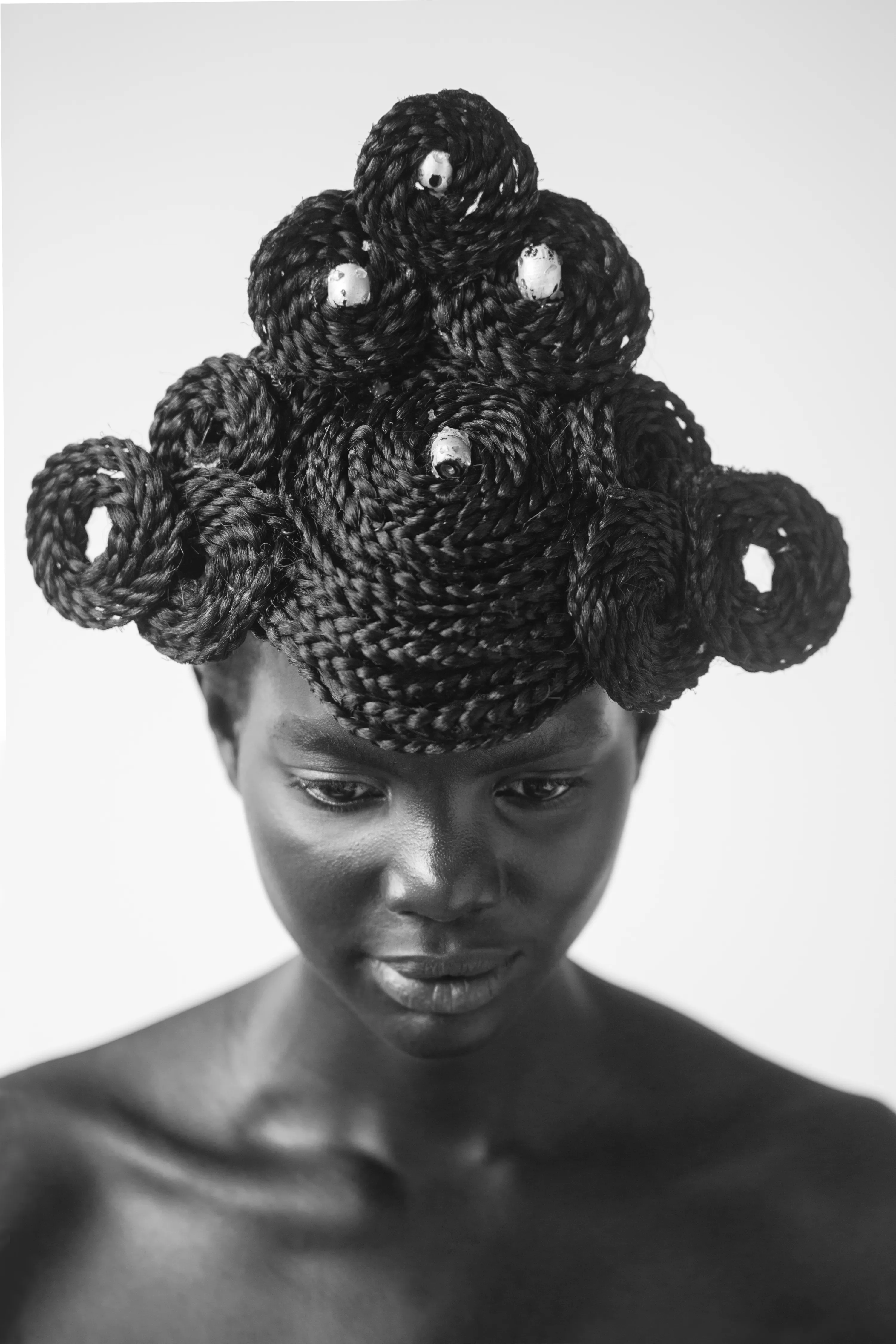 For centuries, the art world was seen through the eyes of a small few who, under a patriarchal society, chose the aesthetic and the narrative—and whose main depiction of the sacred female body was as an objectified and sexualized woman. 

Delphine Diallo aims to change this dynamic. Her intention is for every woman she photographs to feel the image she makes of them is a personal gift. “I am not taking pictures, I am giving pictures,” as Diallo puts it. By engaging in intimate conversations with her subjects, Delphine removes the sense of vulnerability that often comes with being photographed. Working with body painters and jewelry and mask makers, Diallo also uses traditional mythology and spiritual symbols to empower her subjects. Her portraiture is all about connection and exchange. She believes women are deep beings and connects with them on an emotional level. The French-Senegalese photographer spends more time speaking with her subjects than photographing them. 

Diallo’s photographs are never discriminating, yet deeply communicative, and portray women beyond judgment, soaking up their limitless beauty. Diallo's works are meant to encourage every woman to write a personal narrative, to take a stand, to have a firm voice. No preparatory models, sketches, or plans lay behind her photographs, which depict only outstanding feminine painted bodies. It is all a part of the vision flowing out of the artist's mind, grounded in her right brain hemisphere, predominant in her energetic and vibrant personality. 

Drawing elements from eastern mythology and philosophy, whilst always ennobling and empowering women, her practice is reminiscent of Oriental 19th-century painting. Looking at Krishnamurti, Frantz Fanon, Joseph Campbell, Bruce Lee, Aimé Césaire, and A.D. Wilson as deep inspirational sources, her photographs raise awareness, appealing to all women to awaken their senses. Diallo immerses herself in the realm of the feminine universe and her eloquent portraiture technique unveils and stirs unexplored emotion and insight meant to reach beyond appearances. 

“We are in constant search for wonder and growth. I see art as a vessel to express consciousness and as an access to diffuse wisdom, enlightenment, fear, beauty, ugliness, mystery, faith, strength, fearlessness, and universal matter”.

Artist: Delphine Diallo
Series: Highness
Date: 2016