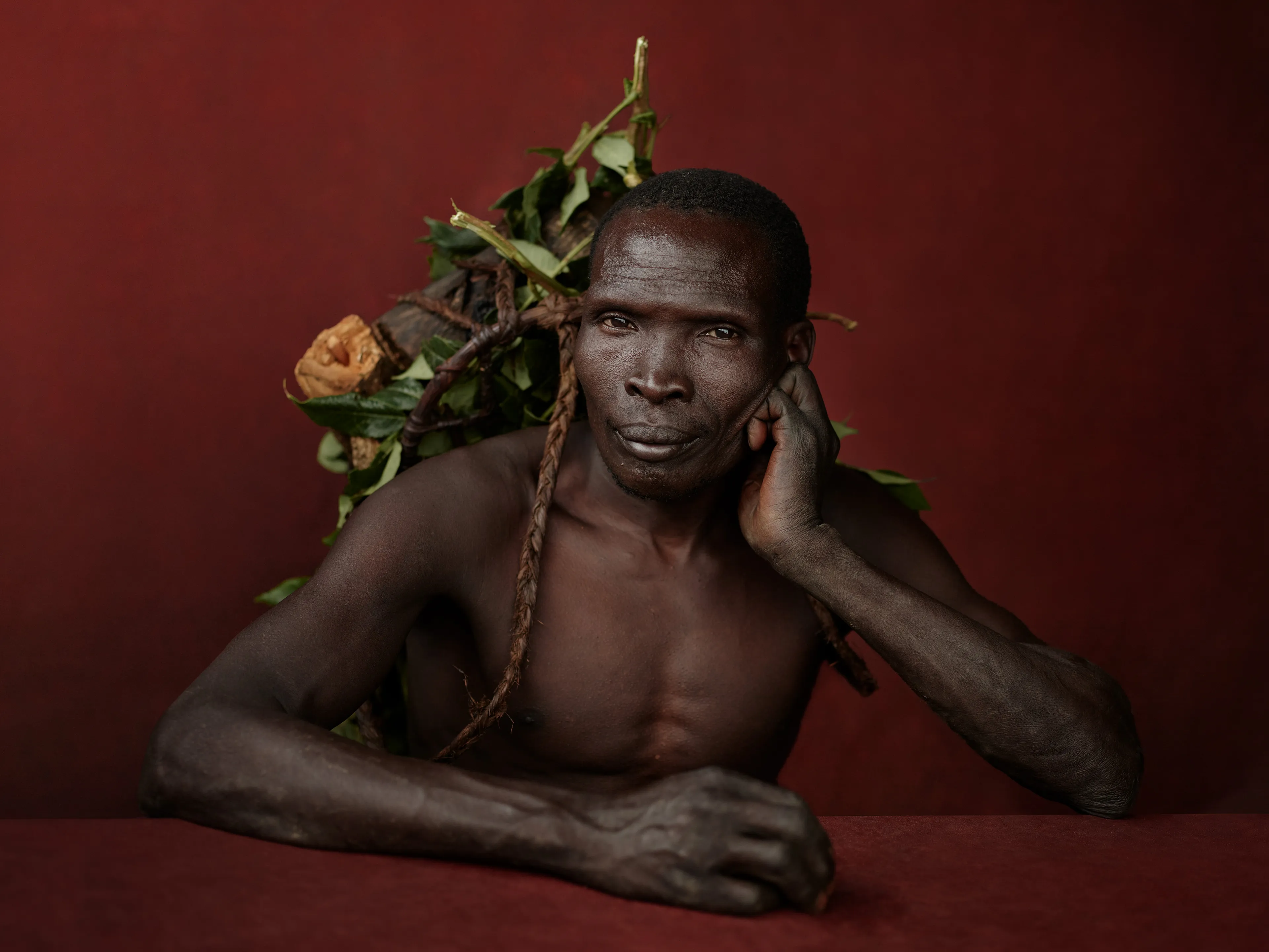Joey L. returns to Quantum with Ethiopia - Portraits: a collection directly linked to his genesis drop during Season 1. For every environmental image from Joey’s first drop, there is a portrait companion.

“For years, we dragged our nomadic studio tent across almost every region of Ethiopia. In our tent, everyone was equal. We captured pure magic. Every kind of person entered and had their portrait taken. The tent was our little fantasy world. It was the Ethiopia that we dreamed of, even when the reality outside of it was sometimes stricken with searing pain. Each portrait was a tribute to a distinct region of the country. Disconnected cultural threads were woven together in a cohesive visual style in order to truly see Ethiopia— which itself is a modern nation state, but is also the sum of all the diverse people who inhabit it.”

Joey’s portraits alternating on red and black backdrops are the visual backbone of my forthcoming book “Ethiopia” (Insight Editions, January 2023), which compiles 13 years of work.

The tent itself is a metal frame modified with diffusion material made out of netela fabric, which is a hand-spun cotton perfected by Dorze craftspeople. Every portrait is created with natural light molded from the tent itself and photographed on location.

Majang, Gambela Region, Ethiopia 
October 2020