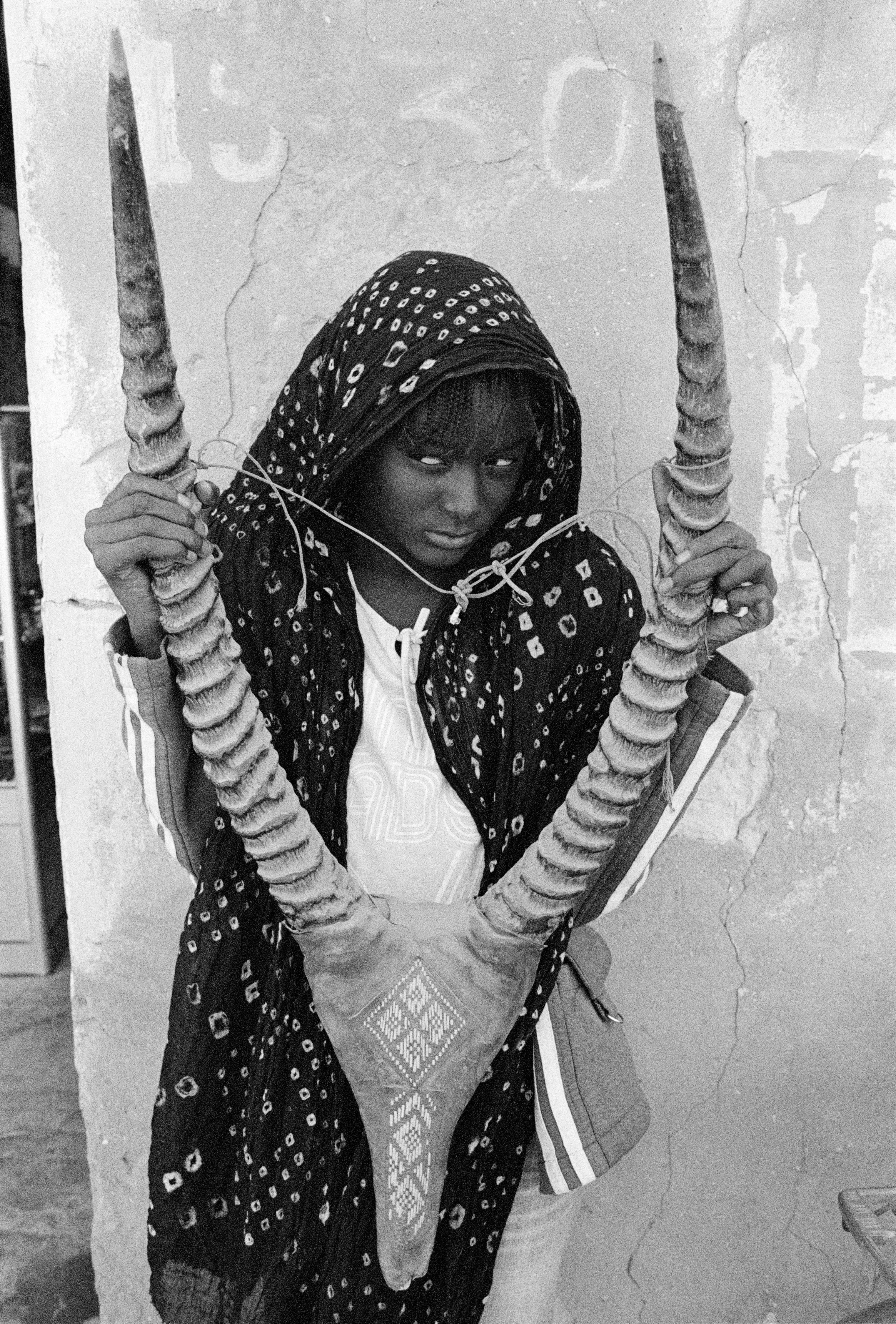For centuries, the art world was seen through the eyes of a small few who, under a patriarchal society, chose the aesthetic and the narrative—and whose main depiction of the sacred female body was as an objectified and sexualized woman. 

Delphine Diallo aims to change this dynamic. Her intention is for every woman she photographs to feel the image she makes of them is a personal gift. “I am not taking pictures, I am giving pictures,” as Diallo puts it. By engaging in intimate conversations with her subjects, Delphine removes the sense of vulnerability that often comes with being photographed. Working with body painters and jewelry and mask makers, Diallo also uses traditional mythology and spiritual symbols to empower her subjects. Her portraiture is all about connection and exchange. She believes women are deep beings and connects with them on an emotional level. The French-Senegalese photographer spends more time speaking with her subjects than photographing them. 

Diallo’s photographs are never discriminating, yet deeply communicative, and portray women beyond judgment, soaking up their limitless beauty. Diallo's works are meant to encourage every woman to write a personal narrative, to take a stand, to have a firm voice. No preparatory models, sketches, or plans lay behind her photographs, which depict only outstanding feminine painted bodies. It is all a part of the vision flowing out of the artist's mind, grounded in her right brain hemisphere, predominant in her energetic and vibrant personality. 

Drawing elements from eastern mythology and philosophy, whilst always ennobling and empowering women, her practice is reminiscent of Oriental 19th-century painting. Looking at Krishnamurti, Frantz Fanon, Joseph Campbell, Bruce Lee, Aimé Césaire, and A.D. Wilson as deep inspirational sources, her photographs raise awareness, appealing to all women to awaken their senses. Diallo immerses herself in the realm of the feminine universe and her eloquent portraiture technique unveils and stirs unexplored emotion and insight meant to reach beyond appearances. 

“We are in constant search for wonder and growth. I see art as a vessel to express consciousness and as an access to diffuse wisdom, enlightenment, fear, beauty, ugliness, mystery, faith, strength, fearlessness, and universal matter”.

Senegal