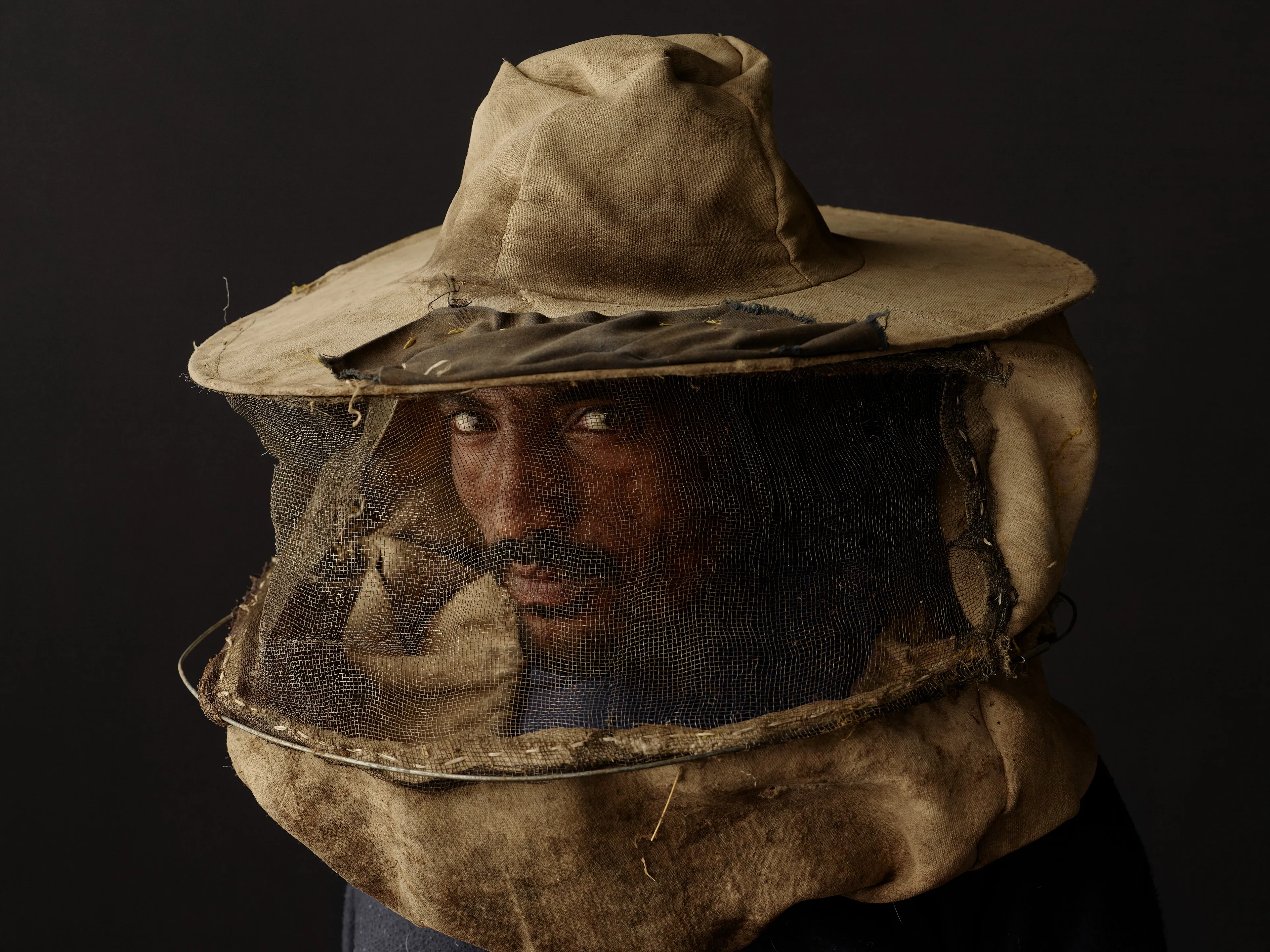Joey L. returns to Quantum with Ethiopia - Portraits: a collection directly linked to his genesis drop during Season 1. For every environmental image from Joey’s first drop, there is a portrait companion.

“For years, we dragged our nomadic studio tent across almost every region of Ethiopia. In our tent, everyone was equal. We captured pure magic. Every kind of person entered and had their portrait taken. The tent was our little fantasy world. It was the Ethiopia that we dreamed of, even when the reality outside of it was sometimes stricken with searing pain. Each portrait was a tribute to a distinct region of the country. Disconnected cultural threads were woven together in a cohesive visual style in order to truly see Ethiopia— which itself is a modern nation state, but is also the sum of all the diverse people who inhabit it.”

Joey’s portraits alternating on red and black backdrops are the visual backbone of my forthcoming book “Ethiopia” (Insight Editions, January 2023), which compiles 13 years of work.

The tent itself is a metal frame modified with diffusion material made out of netela fabric, which is a hand-spun cotton perfected by Dorze craftspeople. Every portrait is created with natural light molded from the tent itself and photographed on location.

Amhara, Bilbala, 
Amhara Region, Ethiopia  
January 2021