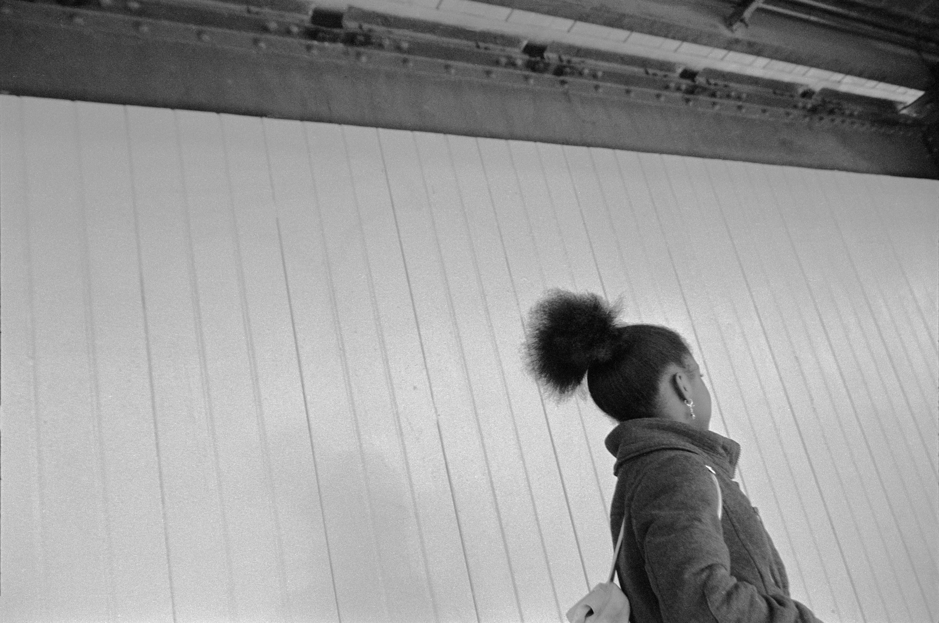 Inspired by the classic observer artists before him (al la Roy DeCarava, Garry Winogrand, and Robert Frank) Laurent Chevalier brings a modern spirit and informed sophistication to this collection of New York City photographs. This collection is a story of New York City, but it is specifically a story of Blackness. Spanning a period of 5 years and punctuated by poetry written by Brooklyn native Dr. Jamila Lysicott, Enough is a tangible exploration of the intersections of the Black experience. Through a lens of candid observation, Enough explores themes of patriotism, power, family and spirit. It does not seek to describe an experience holistically, but rather to present avenues that the viewer may choose and follow at will.

Medium: 35mm black and white negative