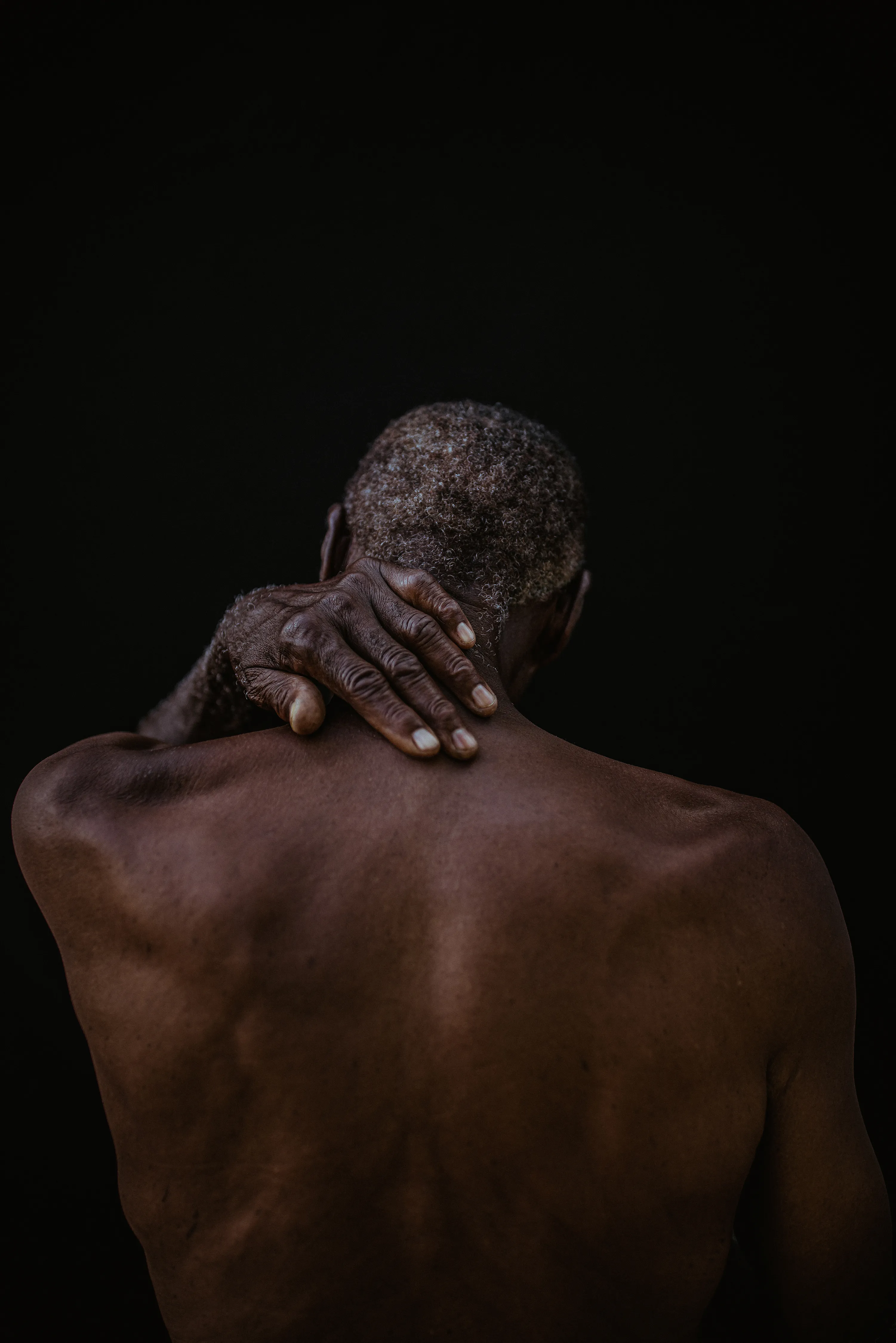 Melissa Alcena is a Nassau-based Bahamian portrait and documentary photographer. Her work often focuses on shifting the settler-colonial narrative of the Caribbean, and specifically The Bahamas. Alcena flips the script by directly engaging with Bahamians, putting them front and centre, showing them and her country as complex, sophisticated, and diverse. Her strong sense of colour, bright light, and deep shadow are  purely homegrown, yet unexpected and nuanced. Reaching past surface appearances framed by the colonial gaze, Alcena reveals the true nature of her sitters and the nation.