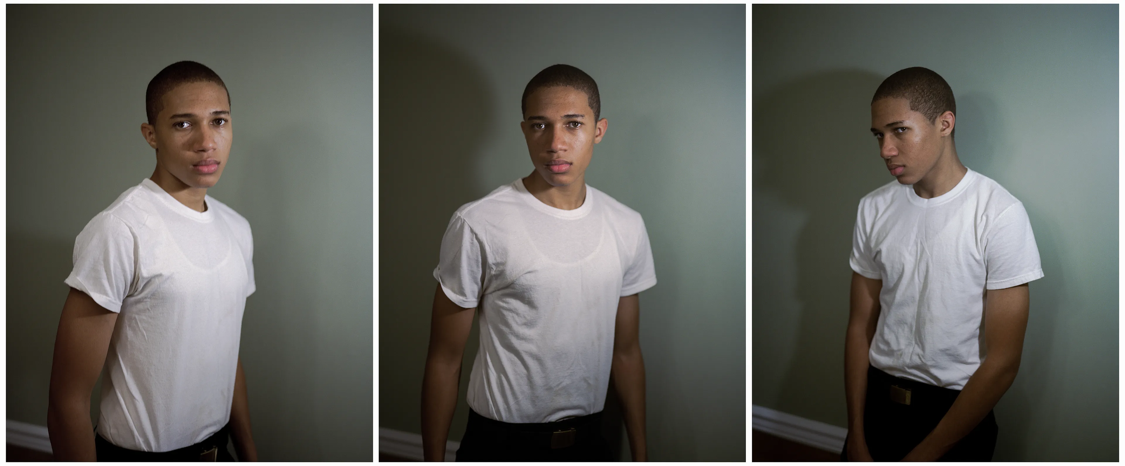 Right before I made the first image of Sharrod, when he went to his bedroom to change, his mother turned to me and said, “Whenever he puts on his uniform, I no longer see my son.”

In the winter of 2008 I met Sharrod, who was in his first year of high school and had recently enrolled in National Junior Reserve Officer’s Training Corps (NJROTC), a military preparatory program offered in high schools nationwide. After explaining my connection to the military and that I was an alum of the same high school that both Sharrod and his mother attended, I asked if I might photograph Sharrod from his freshman to senior year (2008-2012). They both agreed and over the course of the next four years, Sharrod played out his military fantasies for my camera. Sharrod also shared with me the photographs he was making with his cell phone and notebook doodles of weapon construction. These private images and examinations rub up against, color, and compliment the medium format images I’ve made providing the viewer a fuller image of Sharrod’s journey.

Over the course of making the images and video installations for "I slowly watched him disappear," I wondered about the process within which the military body is formed both literally but also psychologically, visually, and emotionally. What is the process of indoctrination and how does the heavy flow of military marketing messages — specifically in military towns— foreclose possibilities for a life beyond the uniform? Furthermore, can one photographically locate the transition from civilian to member of the military unit? 

"I slowly watched him disappear" is the first part of a multimedia “essay” including photographs, video installations, nonfiction films, curatorial projects, and texts which organize my meditations on the fantasy, construction, and deconstruction of the military body and its effects on the broader culture.  