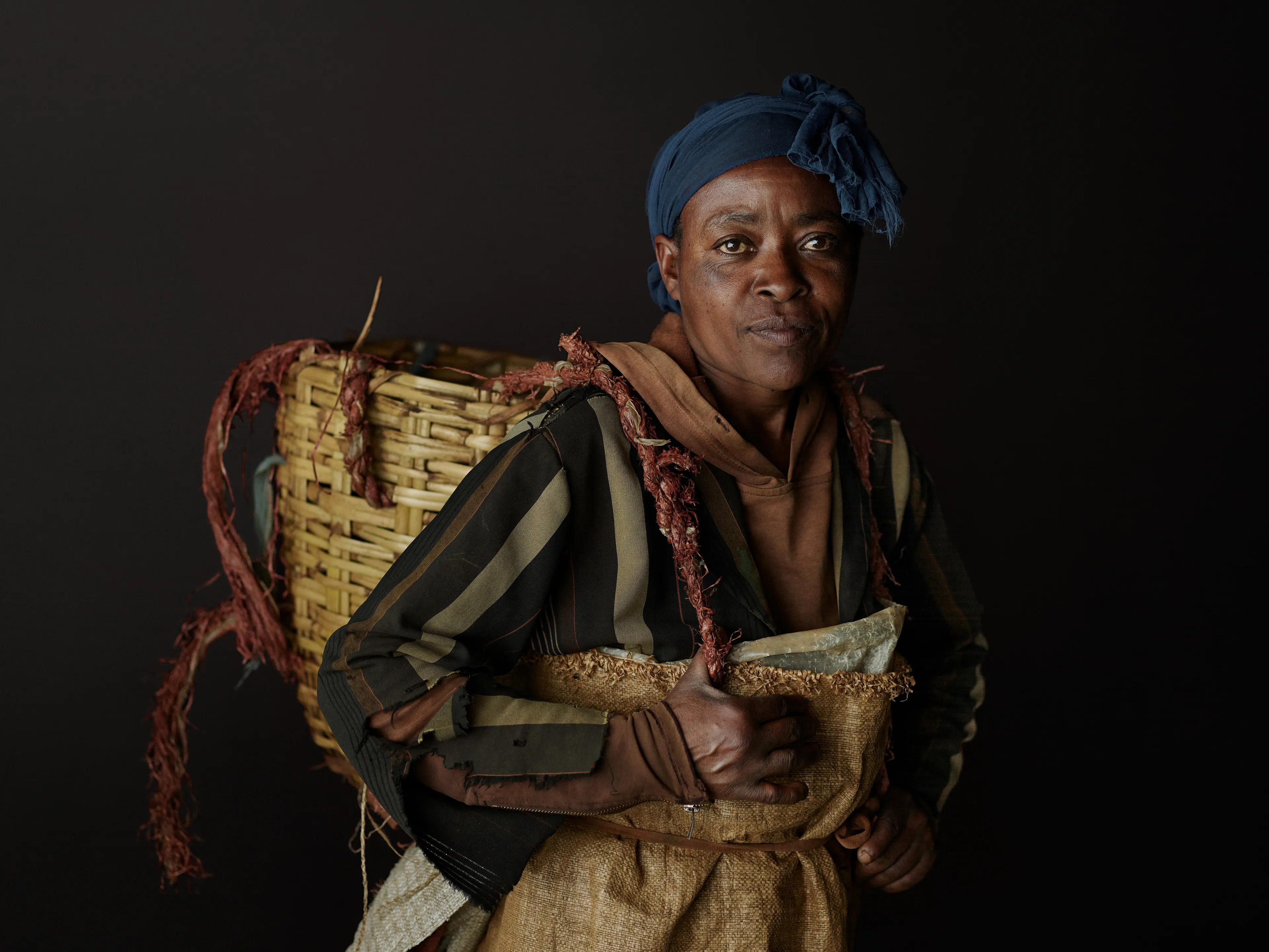 Joey L. returns to Quantum with Ethiopia - Portraits: a collection directly linked to his genesis drop during Season 1. For every environmental image from Joey’s first drop, there is a portrait companion.

“For years, we dragged our nomadic studio tent across almost every region of Ethiopia. In our tent, everyone was equal. We captured pure magic. Every kind of person entered and had their portrait taken. The tent was our little fantasy world. It was the Ethiopia that we dreamed of, even when the reality outside of it was sometimes stricken with searing pain. Each portrait was a tribute to a distinct region of the country. Disconnected cultural threads were woven together in a cohesive visual style in order to truly see Ethiopia— which itself is a modern nation state, but is also the sum of all the diverse people who inhabit it.”

Joey’s portraits alternating on red and black backdrops are the visual backbone of my forthcoming book “Ethiopia” (Insight Editions, January 2023), which compiles 13 years of work.

The tent itself is a metal frame modified with diffusion material made out of netela fabric, which is a hand-spun cotton perfected by Dorze craftspeople. Every portrait is created with natural light molded from the tent itself and photographed on location.

Wushwush, Kafa Zone, Ethiopia 
October 2020
