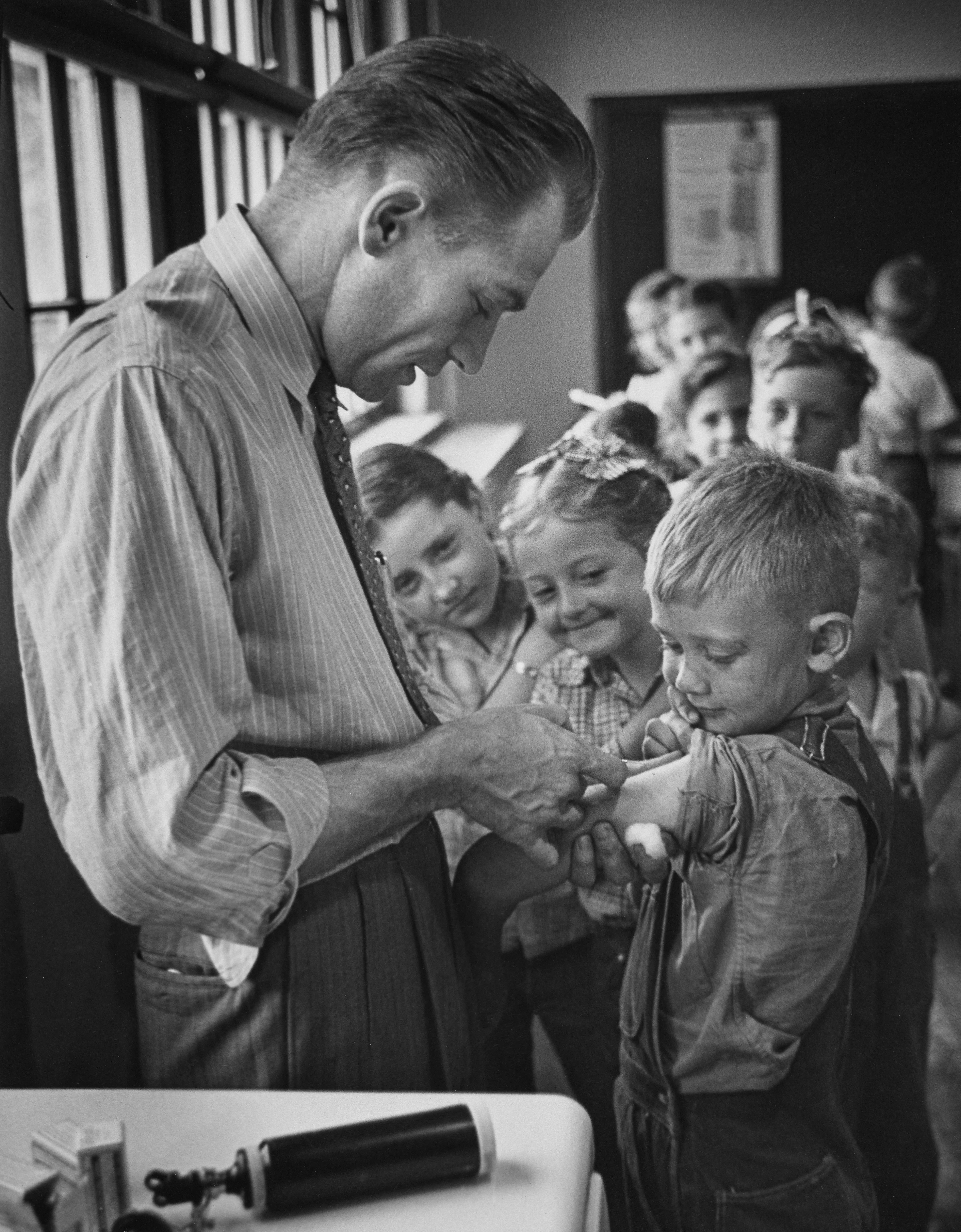 After World War II, LIFE magazine assigned staff photographer W. Eugene Smith a human interest story about a doctor in rural America. They sent him to Kremmling, a small and remote town in northern Colorado. His subject: Dr. Ernest Ceriani. 

At first, Smith observed Dr. Ceriani and earned the trust of the townspeople. He wrote: 'I spent four weeks living with him. I made very few pictures at first. ... I simply faded into the wallpaper and waited.' The resulting story spanned 11 pages in LIFE's September 20, 1948 edition.

Smith's intimate series depicts Dr. Ceriani as a heroic yet weary figure who made house calls, delivered babies, and tended to the young and old alike. Through Smith's lens, Ceriani carries the weight of the world on his shoulders as the only doctor within 400 miles. 

A LIFE compendium later summarized 'Country Doctor' as "an instant classic when published, establishing Smith as a master of the commanding young art form of the photo essay, and solidifying his stature as one of the most passionate and influential photojournalists of the 20th century." As TIME magazine explained in its 2016 compendium '100 Photographs: The Most Influential Images of All Time': "By digging so deeply into his assignment, Smith created a singular, starkly intimate glimpse into the life of a remarkable man. It became not only the most influential photo essay in history but the aspirational template for the form.'"