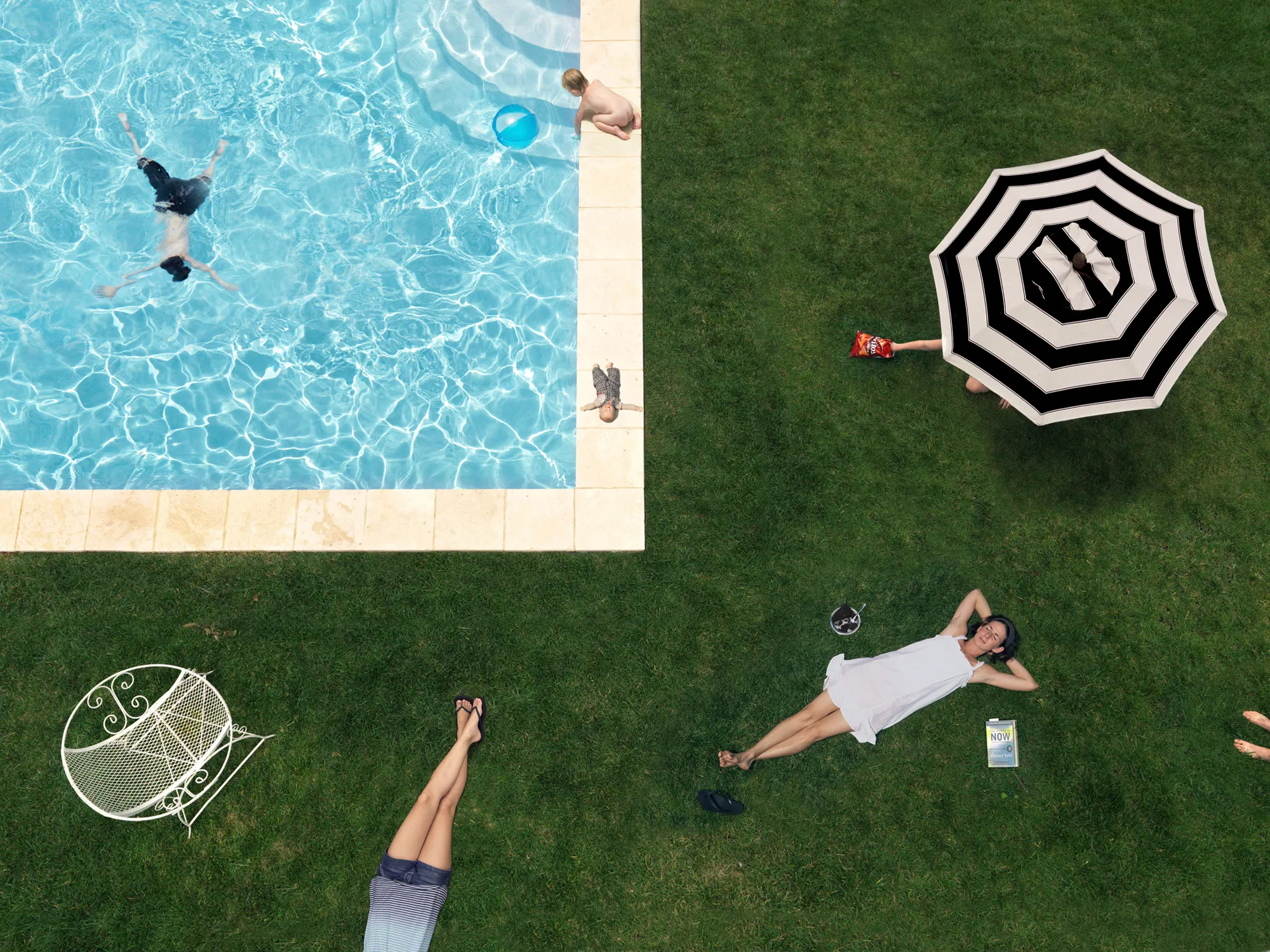 “I suppose I could make a work where the sun is shining, the mom is lying out in the grass, the kids are happy, and everything is perfect, but that wouldn’t interest me—and it wouldn’t be truthful. My aim is to create a more nuanced, subtly humorous and satirical portrait of the way we live today.” - Julie Blackmon

The playfully artful and chaotic elements present in the photographs of Julie Blackmon (American, b. 1966) are drawn from the everyday people and places of Blackmon’s daily routine in her hometown of Springfield, Missouri, which she describes as “a generic American town in the middle of the United States.” At first glance, the works may conjure backyard paradises of children at play; a closer look reveals children alone in backyards, garages, and neighborhoods, where the absence of adults suggests a looming potential for danger. The images brim with fantasy and subtle satire that capture a delicate balance between the darkness and charm of contemporary American life.

Blackmon carefully sets her scenes, but like film and theater
directors, she is in pursuit of unscripted moments that provoke,
disturb, and challenge the viewer. Some of the images reference
paintings by Dutch masters, French impressionists, and such modern painters as Hopper and Balthus, but they are updated with a satirical, penetrating eye and Blackmon’s belief that artful fiction can capture the truth more memorably than the truth itself.

#3