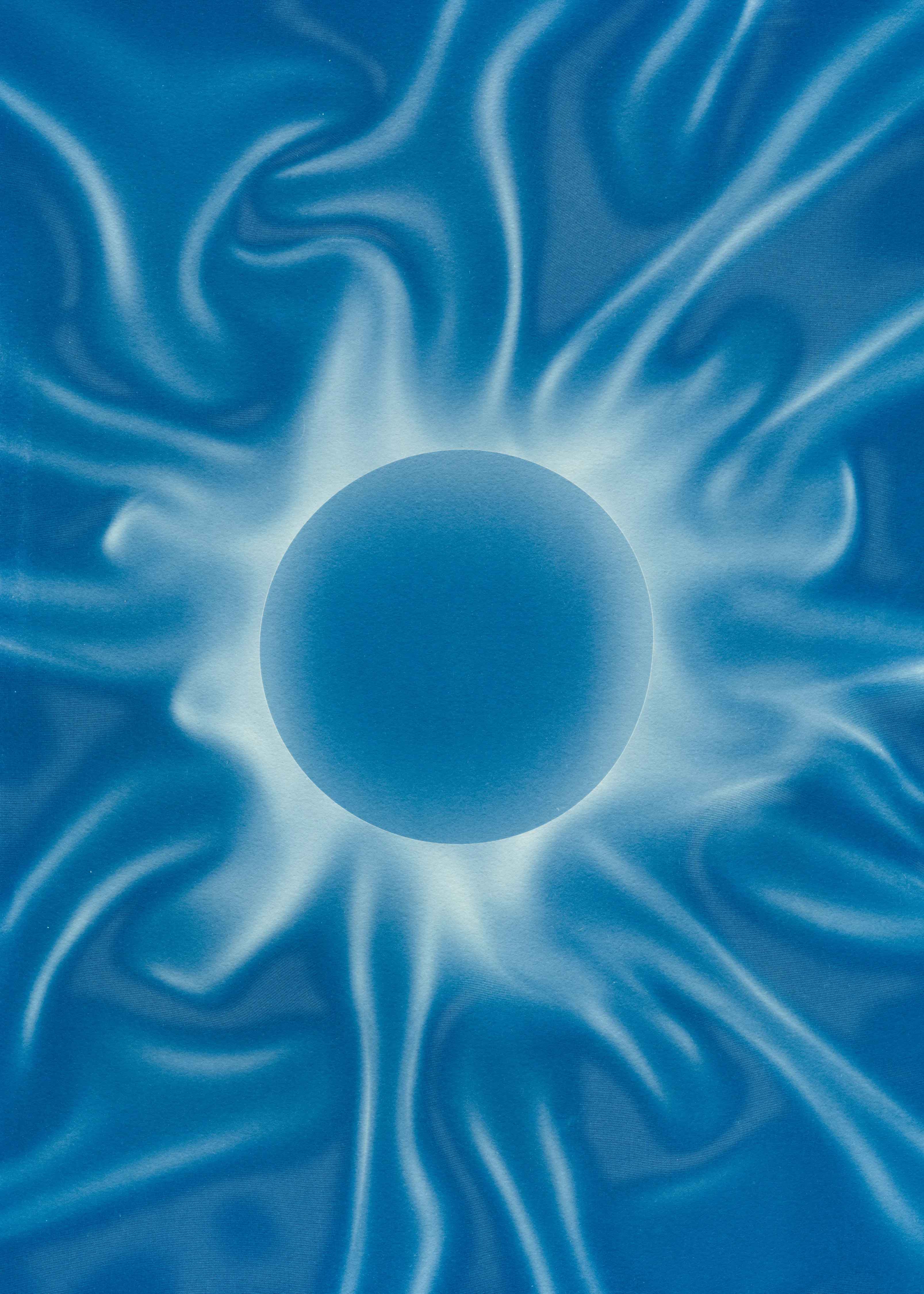 Beyond the Veil is simultaneously a melding of mediums as a means to sculpt with light, and an attempt to
capture the fabric of reality. I work with cyanotype, an alternative photography process that yields blue-
toned impressions when exposed to UV light. 
Cyanotype allows me to interact directly with light, one of the most subtle phenomena we experience day to day. Combined with sculpture, collage and drawing, the
cyanotype process is a powerful creative tool fueled by the sun. Working with light and shadow is to
become aware of how they describe our reality.

Created over the past eight months, this collection has been my safe haven from the world. A finger on the
pulse of something deeper than the chaotic rhythm of daily life, an album of captive sunlight and
experiences preserved in blue. The stillness of winter sunlight, silent rolling waves, a slow, even breath. I
hope you too can find solace here.