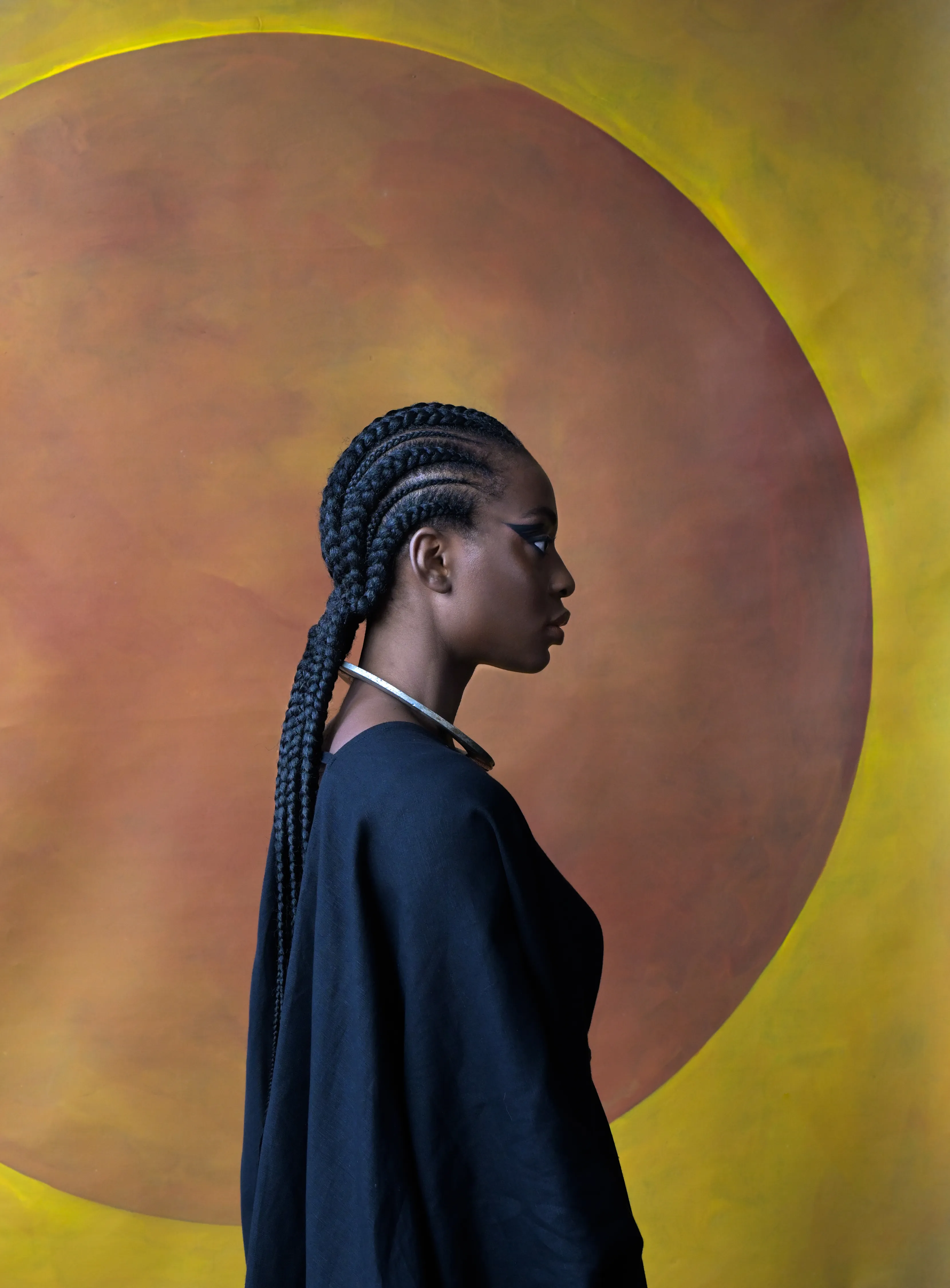 For centuries, the art world was seen through the eyes of a small few who, under a patriarchal society, chose the aesthetic and the narrative—and whose main depiction of the sacred female body was as an objectified and sexualized woman. 

Delphine Diallo aims to change this dynamic. Her intention is for every woman she photographs to feel the image she makes of them is a personal gift. “I am not taking pictures, I am giving pictures,” as Diallo puts it. By engaging in intimate conversations with her subjects, Delphine removes the sense of vulnerability that often comes with being photographed. Working with body painters and jewelry and mask makers, Diallo also uses traditional mythology and spiritual symbols to empower her subjects. Her portraiture is all about connection and exchange. She believes women are deep beings and connects with them on an emotional level. The French-Senegalese photographer spends more time speaking with her subjects than photographing them. 

Diallo’s photographs are never discriminating, yet deeply communicative, and portray women beyond judgment, soaking up their limitless beauty. Diallo's works are meant to encourage every woman to write a personal narrative, to take a stand, to have a firm voice. No preparatory models, sketches, or plans lay behind her photographs, which depict only outstanding feminine painted bodies. It is all a part of the vision flowing out of the artist's mind, grounded in her right brain hemisphere, predominant in her energetic and vibrant personality. 

Drawing elements from eastern mythology and philosophy, whilst always ennobling and empowering women, her practice is reminiscent of Oriental 19th-century painting. Looking at Krishnamurti, Frantz Fanon, Joseph Campbell, Bruce Lee, Aimé Césaire, and A.D. Wilson as deep inspirational sources, her photographs raise awareness, appealing to all women to awaken their senses. Diallo immerses herself in the realm of the feminine universe and her eloquent portraiture technique unveils and stirs unexplored emotion and insight meant to reach beyond appearances. 

“We are in constant search for wonder and growth. I see art as a vessel to express consciousness and as an access to diffuse wisdom, enlightenment, fear, beauty, ugliness, mystery, faith, strength, fearlessness, and universal matter”.

Artist: Delphine Diallo
Series: God is a Woman
Date: 2020