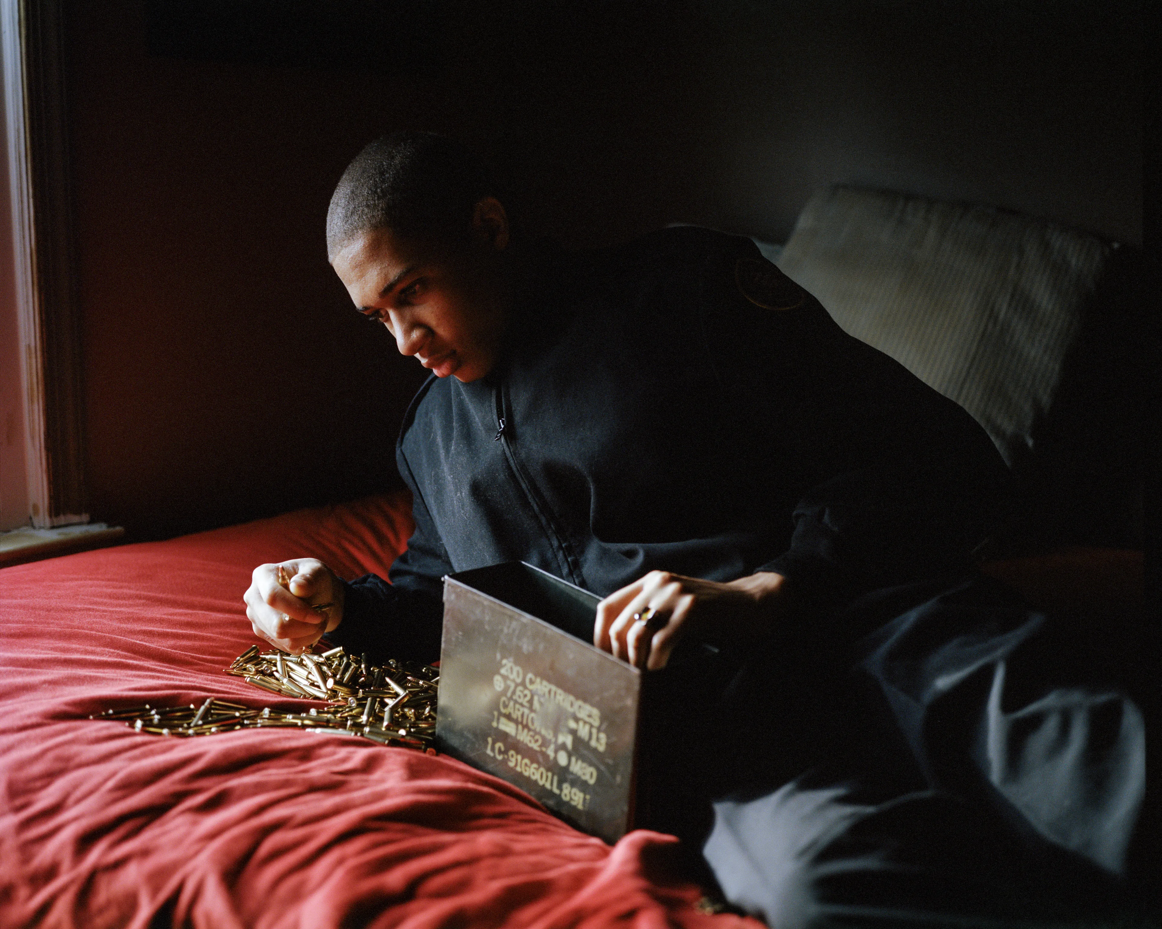 Right before I made the first image of Sharrod, when he went to his bedroom to change, his mother turned to me and said, “Whenever he puts on his uniform, I no longer see my son.”

In the winter of 2008 I met Sharrod, who was in his first year of high school and had recently enrolled in National Junior Reserve Officer’s Training Corps (NJROTC), a military preparatory program offered in high schools nationwide. After explaining my connection to the military and that I was an alum of the same high school that both Sharrod and his mother attended, I asked if I might photograph Sharrod from his freshman to senior year (2008-2012). They both agreed and over the course of the next four years, Sharrod played out his military fantasies for my camera. Sharrod also shared with me the photographs he was making with his cell phone and notebook doodles of weapon construction. These private images and examinations rub up against, color, and compliment the medium format images I’ve made providing the viewer a fuller image of Sharrod’s journey.

Over the course of making the images and video installations for "I slowly watched him disappear," I wondered about the process within which the military body is formed both literally but also psychologically, visually, and emotionally. What is the process of indoctrination and how does the heavy flow of military marketing messages — specifically in military towns— foreclose possibilities for a life beyond the uniform? Furthermore, can one photographically locate the transition from civilian to member of the military unit? 

"I slowly watched him disappear" is the first part of a multimedia “essay” including photographs, video installations, nonfiction films, curatorial projects, and texts which organize my meditations on the fantasy, construction, and deconstruction of the military body and its effects on the broader culture.  