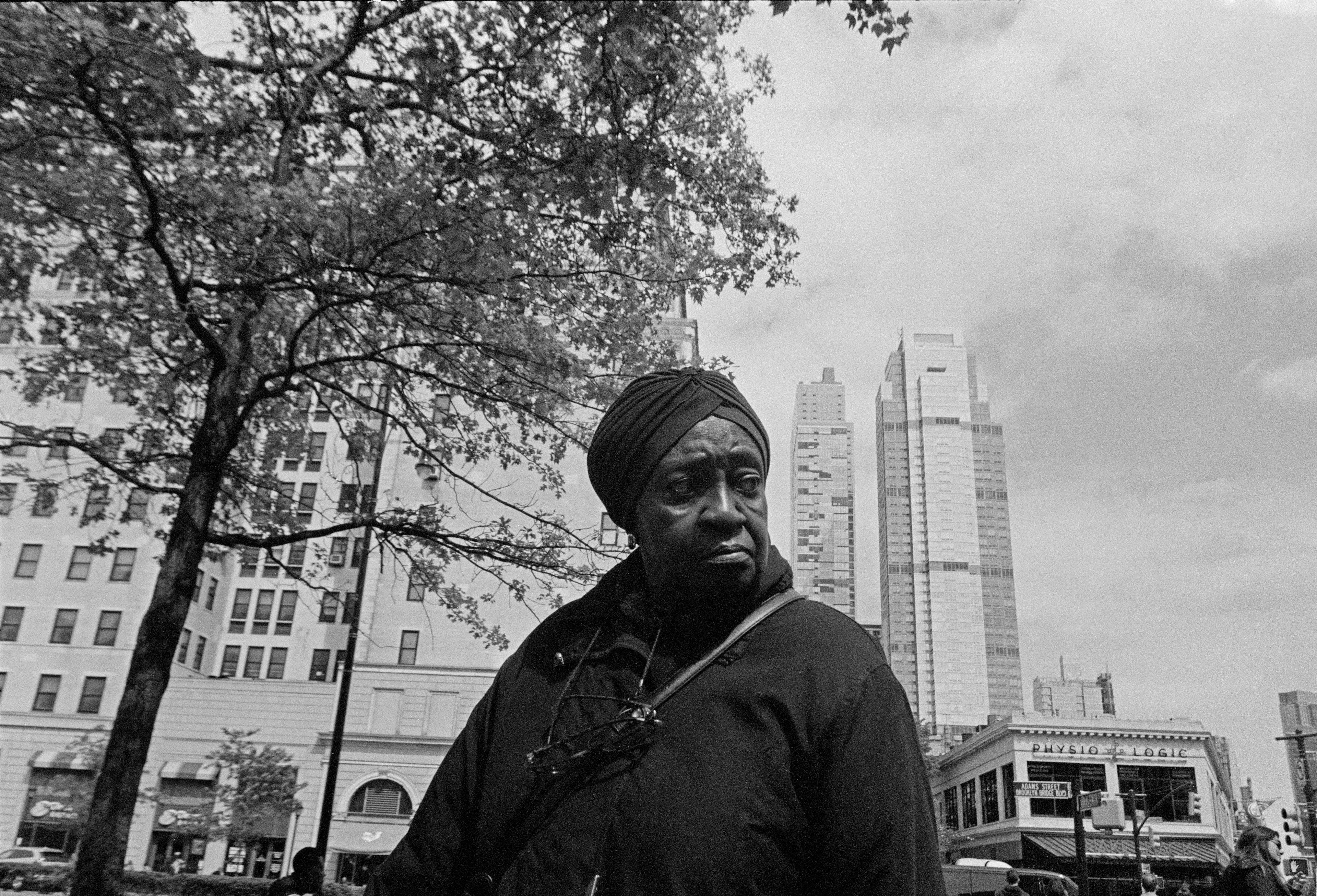 Inspired by the classic observer artists before him (al la Roy DeCarava, Garry Winogrand, and Robert Frank) Laurent Chevalier brings a modern spirit and informed sophistication to this collection of New York City photographs. This collection is a story of New York City, but it is specifically a story of Blackness. Spanning a period of 5 years and punctuated by poetry written by Brooklyn native Dr. Jamila Lysicott, Enough is a tangible exploration of the intersections of the Black experience. Through a lens of candid observation, Enough explores themes of patriotism, power, family and spirit. It does not seek to describe an experience holistically, but rather to present avenues that the viewer may choose and follow at will.

Medium: 35mm black and white negative