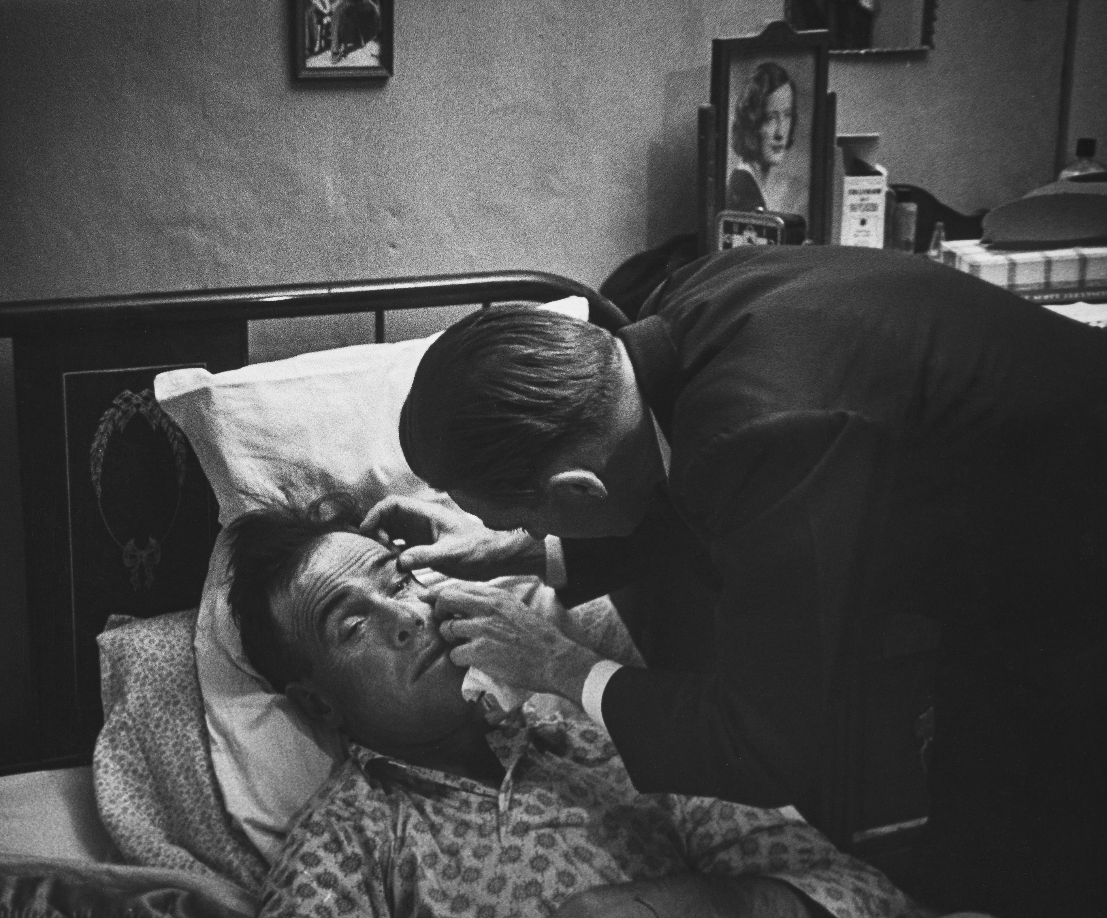 After World War II, LIFE magazine assigned staff photographer W. Eugene Smith a human interest story about a doctor in rural America. They sent him to Kremmling, a small and remote town in northern Colorado. His subject: Dr. Ernest Ceriani. 

At first, Smith observed Dr. Ceriani and earned the trust of the townspeople. He wrote: 'I spent four weeks living with him. I made very few pictures at first. ... I simply faded into the wallpaper and waited.' The resulting story spanned 11 pages in LIFE's September 20, 1948 edition.

Smith's intimate series depicts Dr. Ceriani as a heroic yet weary figure who made house calls, delivered babies, and tended to the young and old alike. Through Smith's lens, Ceriani carries the weight of the world on his shoulders as the only doctor within 400 miles. 

A LIFE compendium later summarized 'Country Doctor' as "an instant classic when published, establishing Smith as a master of the commanding young art form of the photo essay, and solidifying his stature as one of the most passionate and influential photojournalists of the 20th century." As TIME magazine explained in its 2016 compendium '100 Photographs: The Most Influential Images of All Time': "By digging so deeply into his assignment, Smith created a singular, starkly intimate glimpse into the life of a remarkable man. It became not only the most influential photo essay in history but the aspirational template for the form.'"