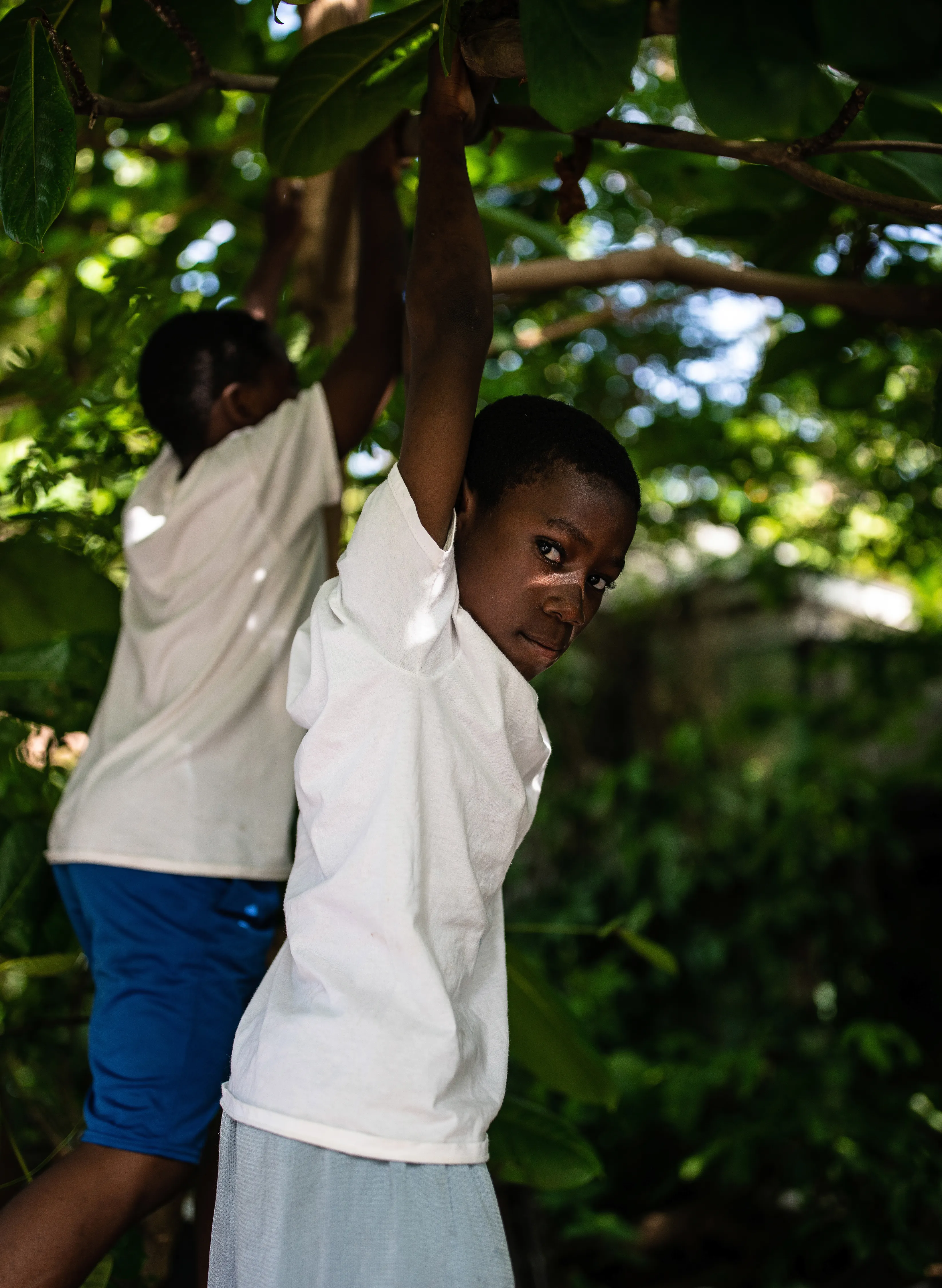 Melissa Alcena is a Nassau-based Bahamian portrait and documentary photographer. Her work often focuses on shifting the settler-colonial narrative of the Caribbean, and specifically The Bahamas. Alcena flips the script by directly engaging with Bahamians, putting them front and centre, showing them and her country as complex, sophisticated, and diverse. Her strong sense of colour, bright light, and deep shadow are  purely homegrown, yet unexpected and nuanced. Reaching past surface appearances framed by the colonial gaze, Alcena reveals the true nature of her sitters and the nation.