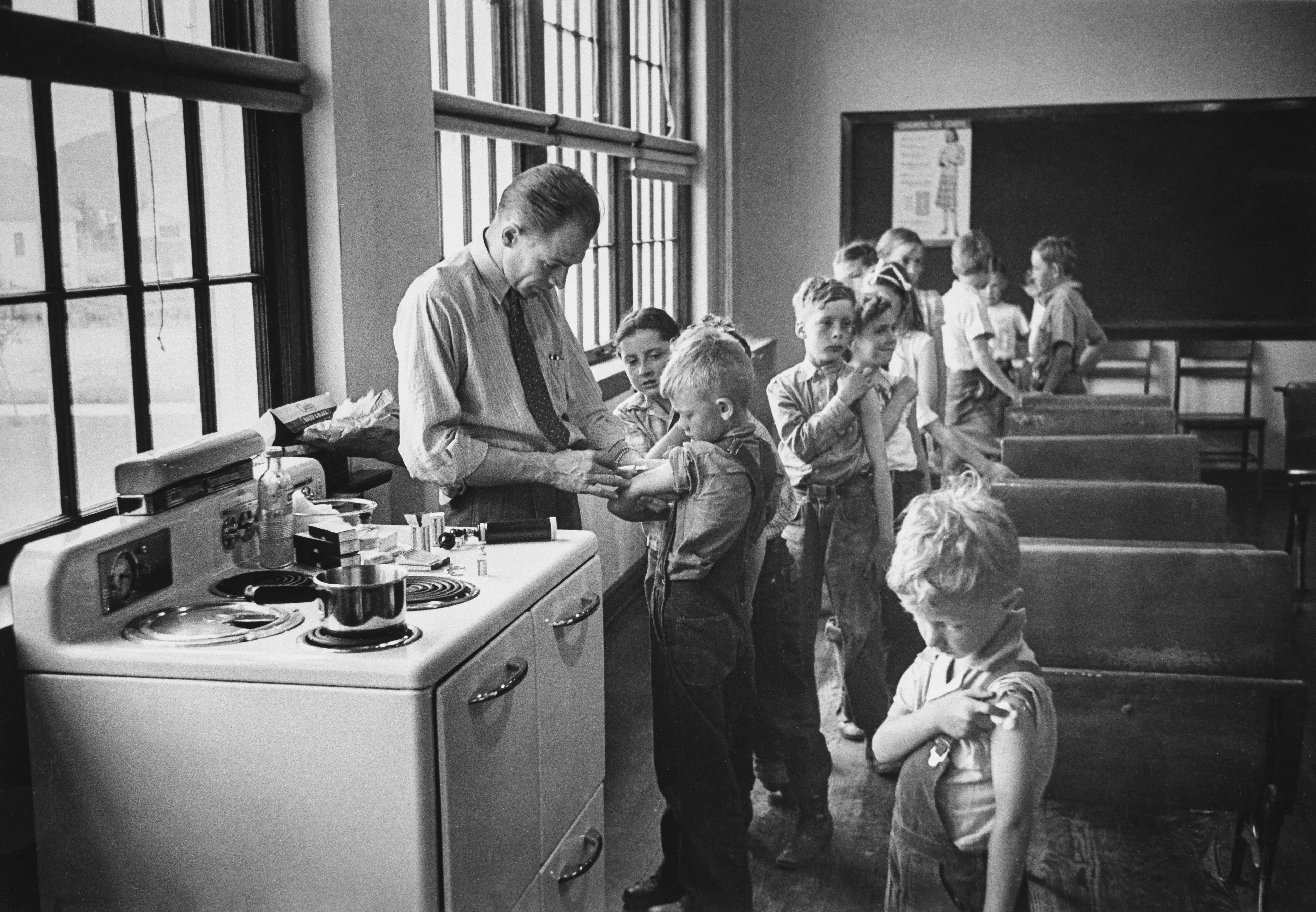 After World War II, LIFE magazine assigned staff photographer W. Eugene Smith a human interest story about a doctor in rural America. They sent him to Kremmling, a small and remote town in northern Colorado. His subject: Dr. Ernest Ceriani. 

At first, Smith observed Dr. Ceriani and earned the trust of the townspeople. He wrote: 'I spent four weeks living with him. I made very few pictures at first. ... I simply faded into the wallpaper and waited.' The resulting story spanned 11 pages in LIFE's September 20, 1948 edition.

Smith's intimate series depicts Dr. Ceriani as a heroic yet weary figure who made house calls, delivered babies, and tended to the young and old alike. Through Smith's lens, Ceriani carries the weight of the world on his shoulders as the only doctor within 400 miles. 

A LIFE compendium later summarized 'Country Doctor' as "an instant classic when published, establishing Smith as a master of the commanding young art form of the photo essay, and solidifying his stature as one of the most passionate and influential photojournalists of the 20th century." As TIME magazine explained in its 2016 compendium '100 Photographs: The Most Influential Images of All Time': "By digging so deeply into his assignment, Smith created a singular, starkly intimate glimpse into the life of a remarkable man. It became not only the most influential photo essay in history but the aspirational template for the form.'"