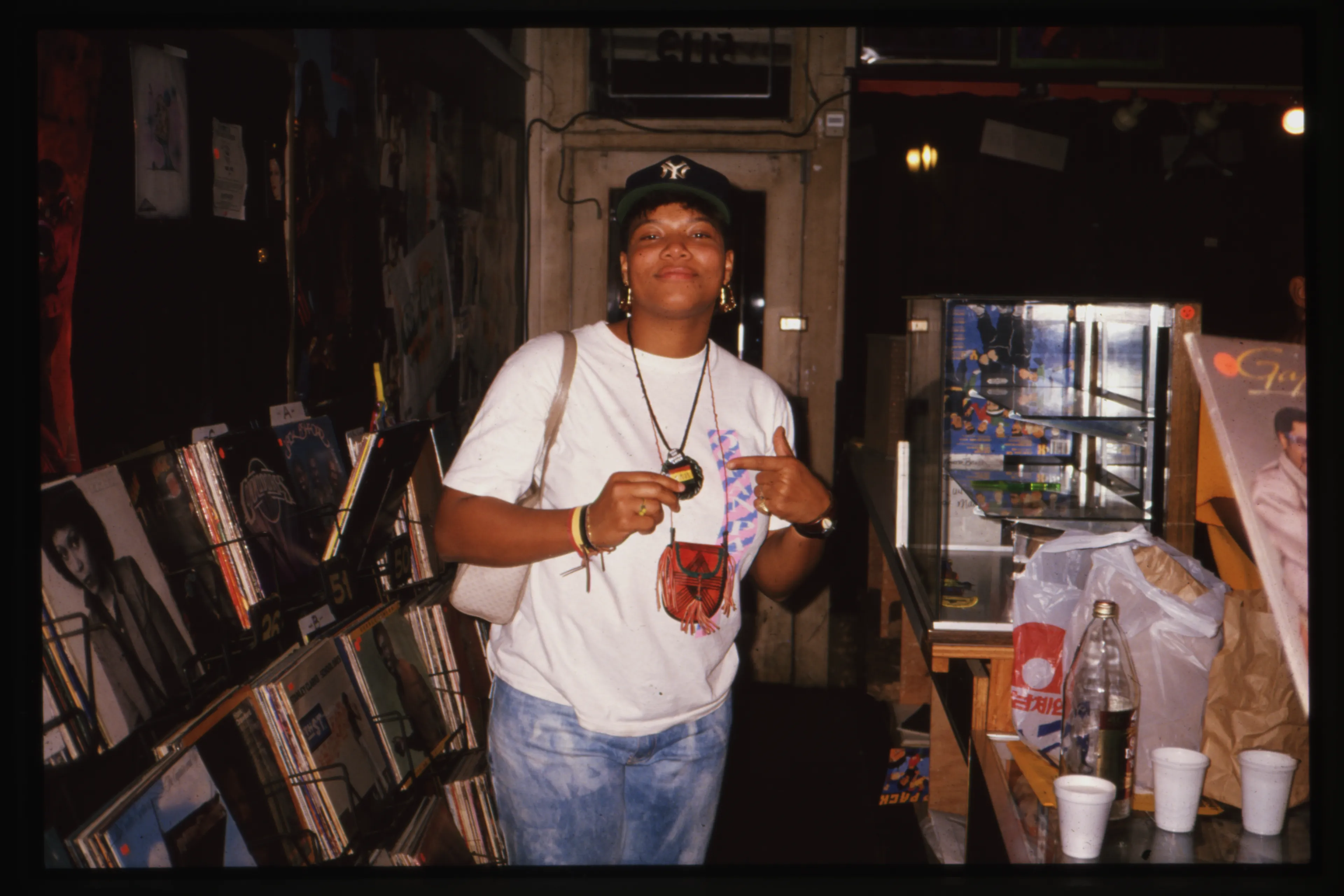 During the late 80's to early 90's I extensively documented the rise of the west coast hip hop scene. My loft/studio on Pico Blvd near Fairfax was next door to Crains Records, an indy shop that specialized in Soul, R&B and Hip Hop. All the artists came through Crains on their PR tours and I would often shoot portraits of them in my studio. I also produced a short run 'zine about the LA music scene called the LA Informer, and had the privilege of making exclusive photographs of NWA in the studio very early in their career while recording Straight Outta Compton. Tragically, my entire archive of photographs and negatives from this era was destroyed by USPS in a horrific accident in 2015 en route to NY. Only a few images that I had in my personal possession remain. 

I photographed Queen Latifah several times in the late 1980's, including doing portraits of her when she was a student at USC. This was shot at Crain's Records, next door to my studio.