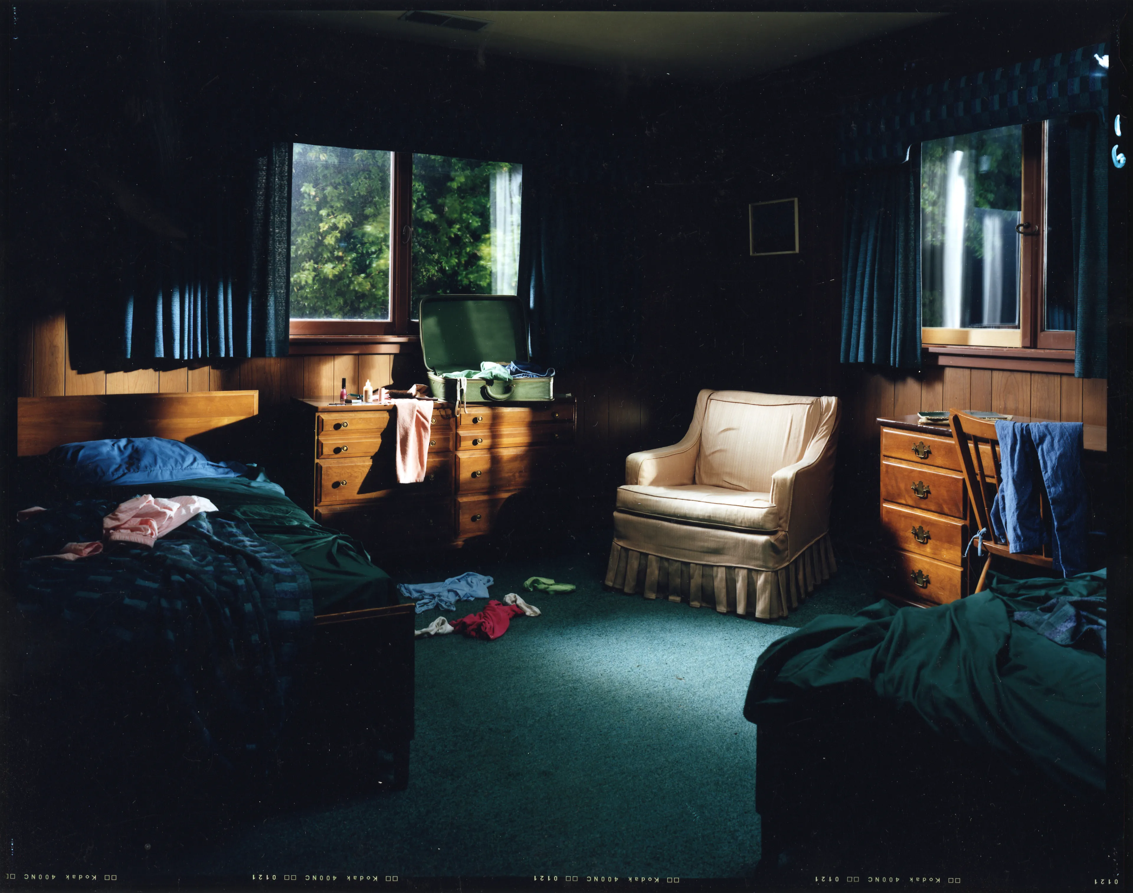 Crewdson’s 2002 project, Dream House peers into the unseen psychological dramas of domestic American life. Focused largely on elaborately staged scenes of home interiors, the twelve images from this portfolio represent frozen moments filled with clues and gestures that suggest underlying narrative sequences that bend ideas of family life into surrealist fantasy. In Dream House, Crewdson nods to the significant influence of cinema over his work by employing actors such as Philip Seymour Hoffman, Tilda Swinton, and Gwyneth Paltrow to stand in as subjects to perform Crewdson’s melodramas in still form. In doing so, Crewdson emphasizes the power of still narrative in relationship to stories told through time, and argues that photographic storytelling can exist as equal in stature to box office films.

Edition: 1 of 1