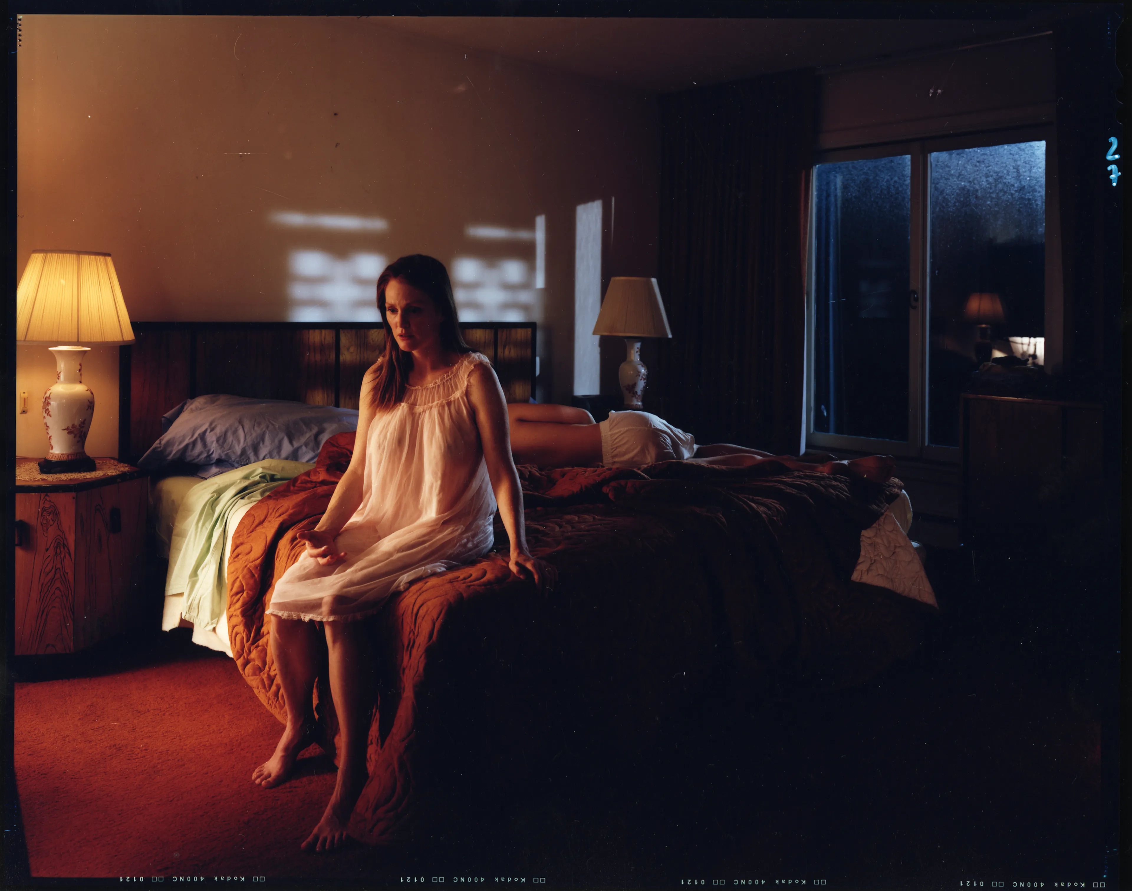 Crewdson’s 2002 project, Dream House peers into the unseen psychological dramas of domestic American life. Focused largely on elaborately staged scenes of home interiors, the twelve images from this portfolio represent frozen moments filled with clues and gestures that suggest underlying narrative sequences that bend ideas of family life into surrealist fantasy. In Dream House, Crewdson nods to the significant influence of cinema over his work by employing actors such as Philip Seymour Hoffman, Tilda Swinton, and Gwyneth Paltrow to stand in as subjects to perform Crewdson’s melodramas in still form. In doing so, Crewdson emphasizes the power of still narrative in relationship to stories told through time, and argues that photographic storytelling can exist as equal in stature to box office films.

Edition: 1 of 1