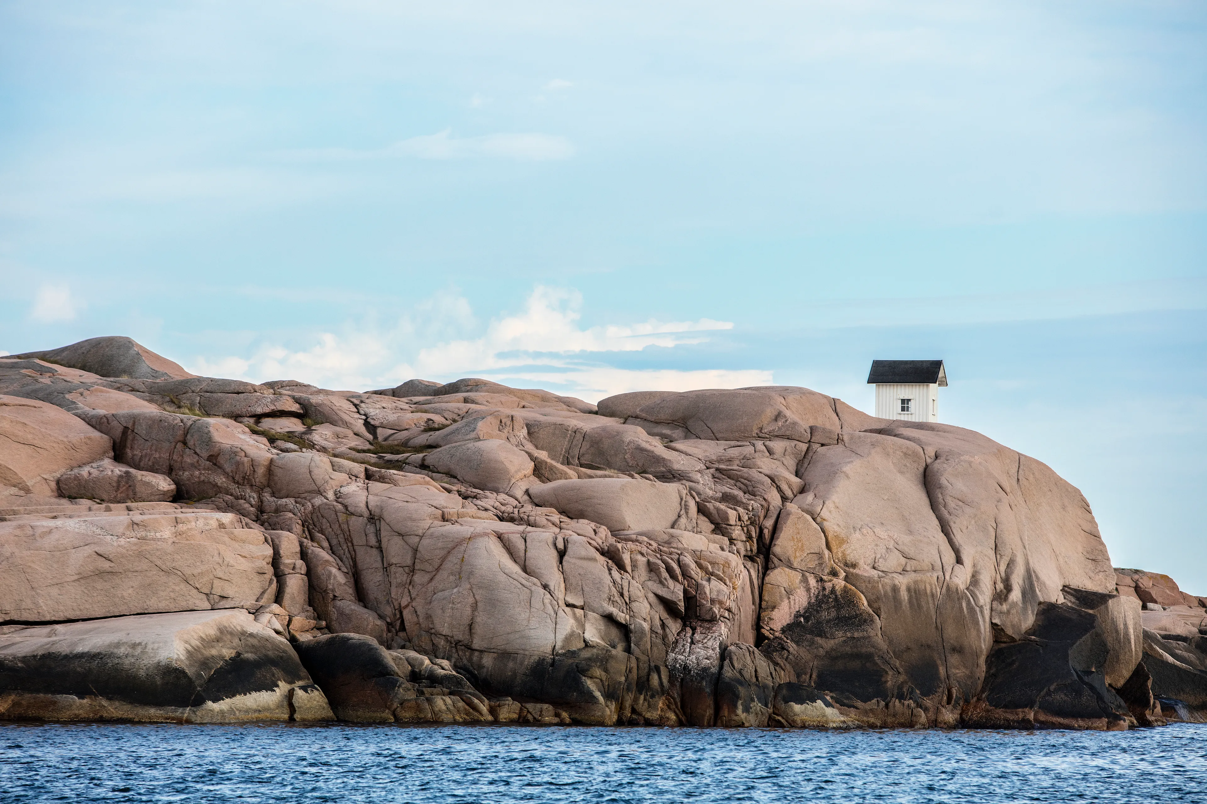On the remote Swedish West Coast, a cabin stands alone. (by Ryan Koopmans - Sweden, 2016)