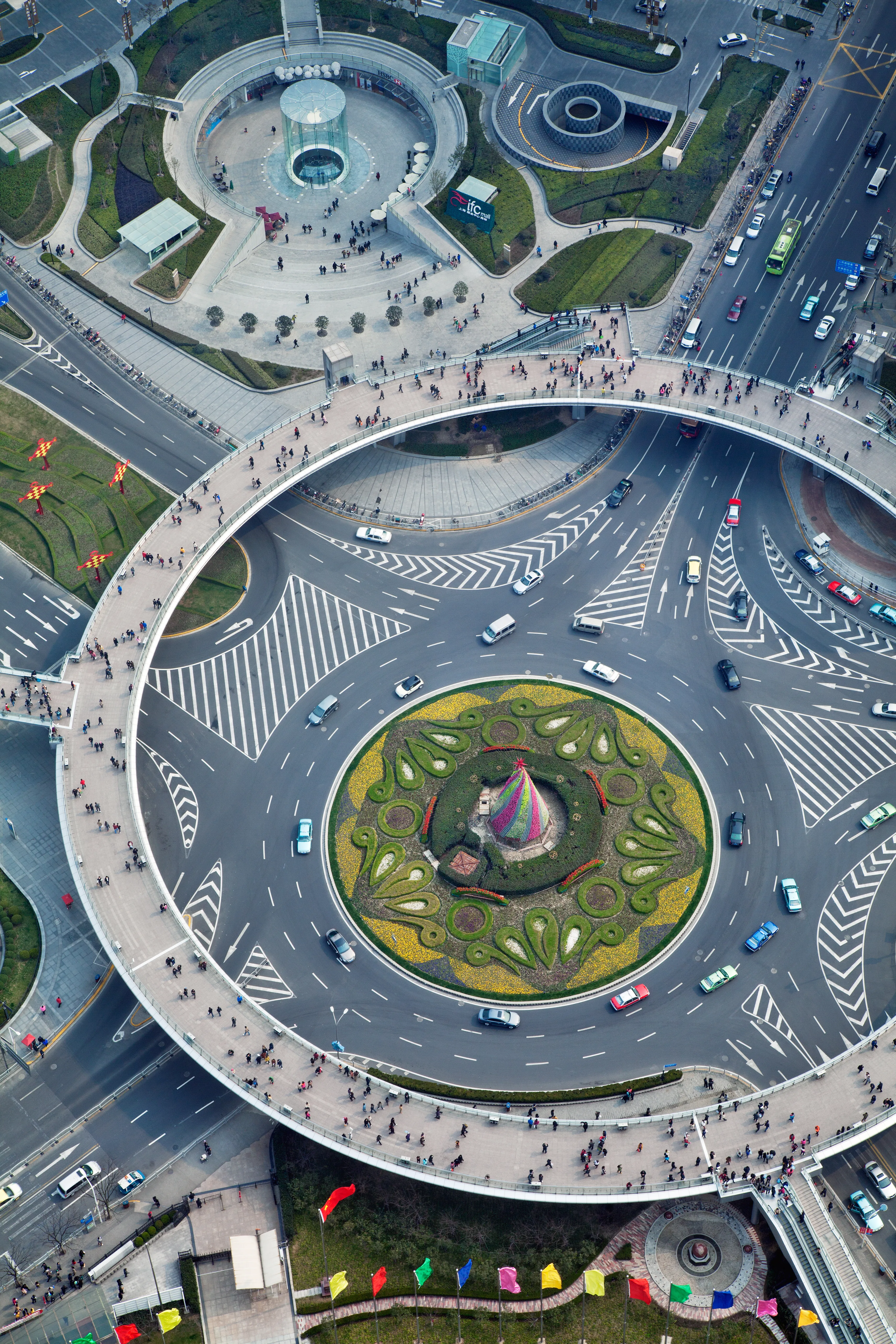 An enormous roundabout functions as ornament and traffic control in the financial heart of Shanghai. (by Ryan Koopmans - China, 2012)