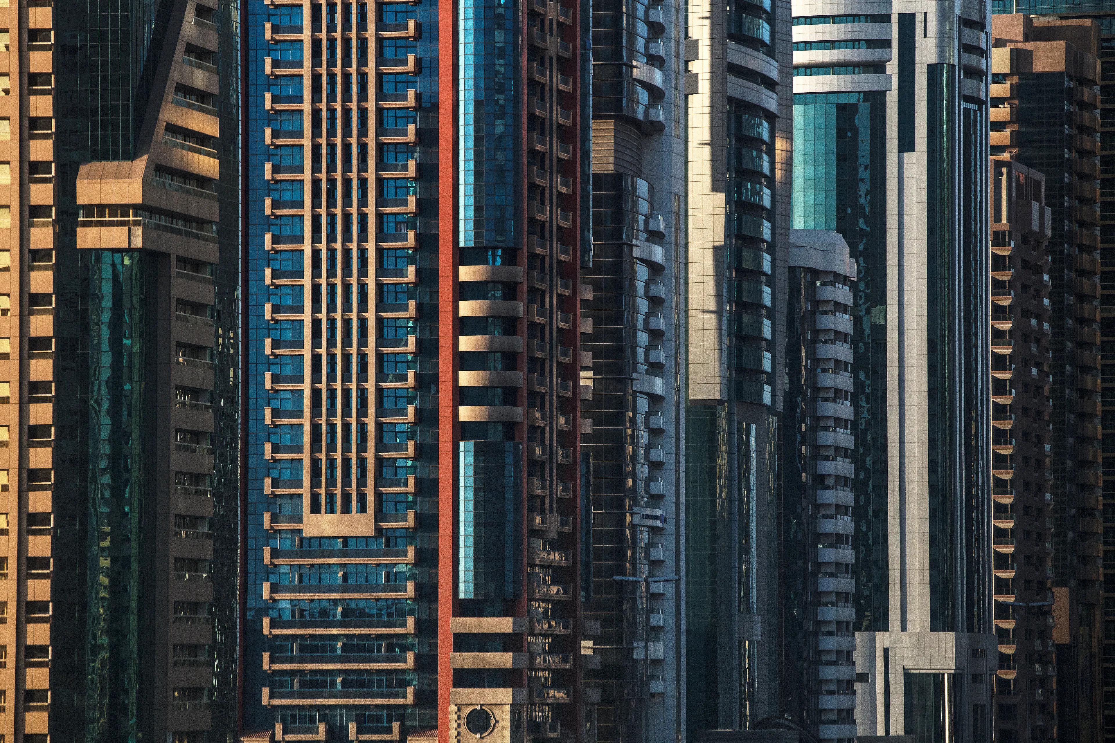 Densely packed skyscraper facades in the central business district of Dubai, UAE. (by Ryan Koopmans - UAE, 2017)