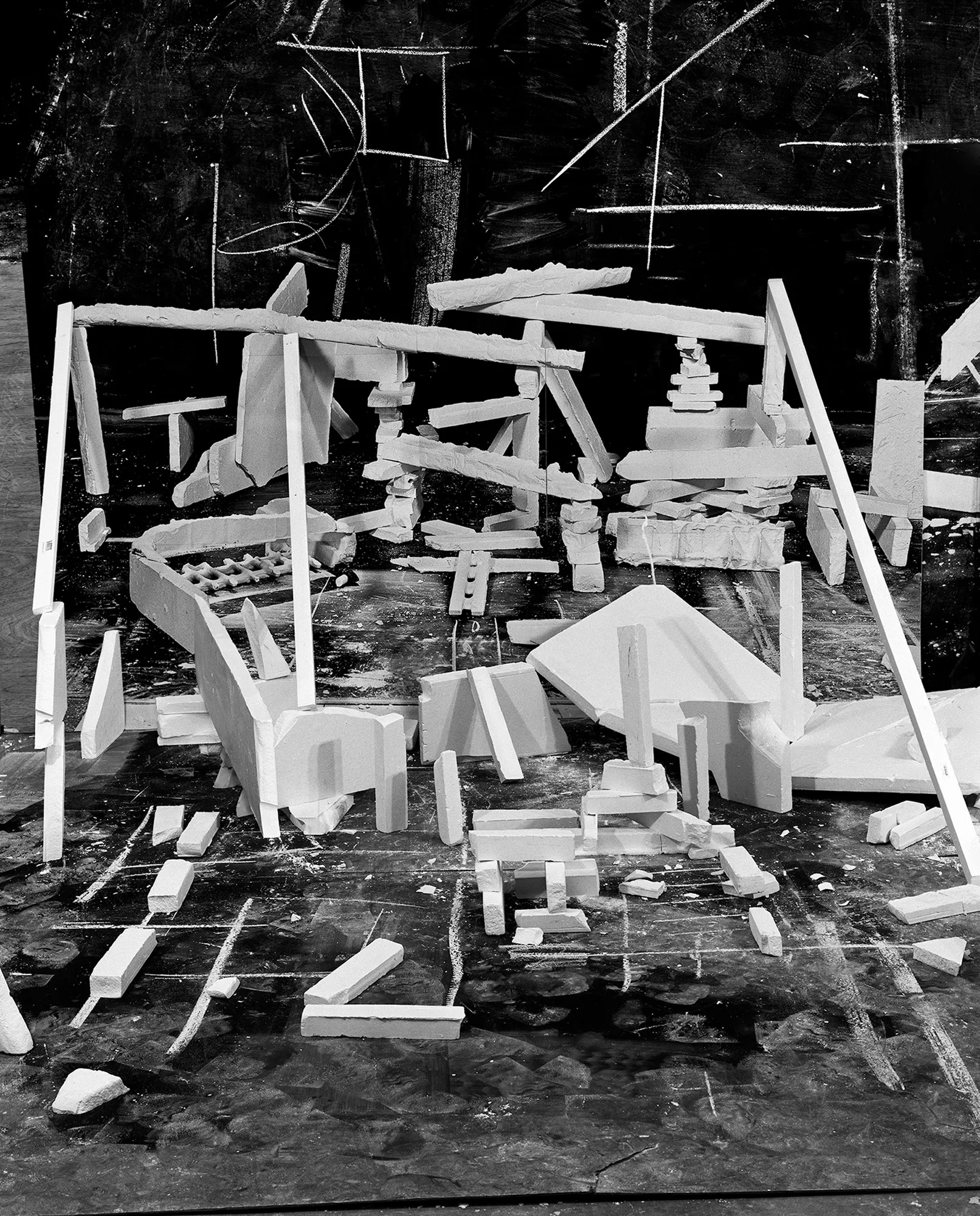 *Constructions* is my first NFT project, weaving together two of my most significant photographic series—*American Type* and *Hedonic Reversal*—as a unique set of 28 images. These architectural constructions, which I make in my studio and then photograph, reference forces of urban construction, destruction, and decay. Devoid of the depictions of labor from which these works were created and of which the work is inherently about, I also critique the ambiguity of post-war American abstraction and art world elitism. These works reference autobiographical threads in order to point to the larger sociopolitical backdrop upon which issues of migration and labor play out.