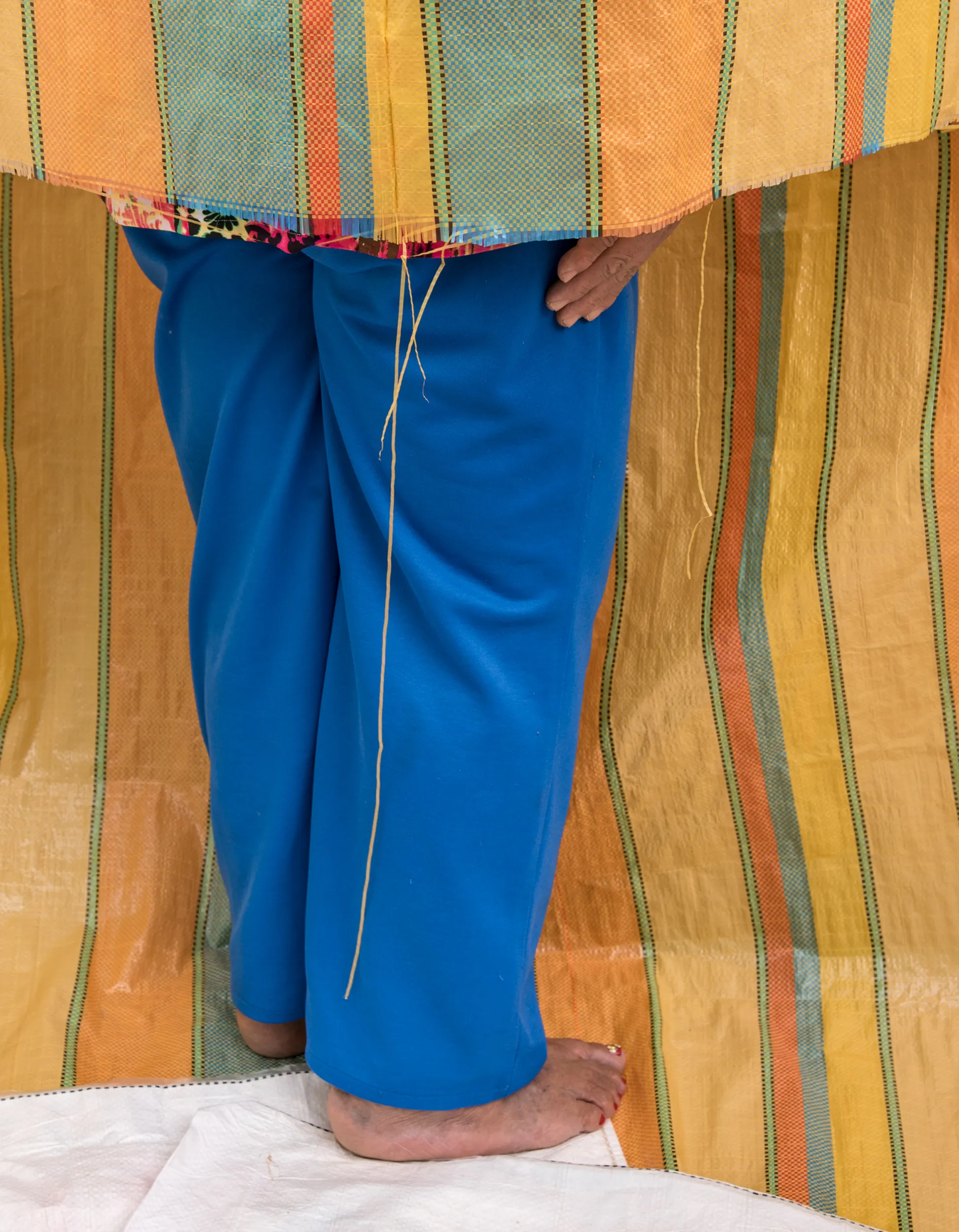 Assembly presents *El Nuevo Mundo* by Cristina Velásquez, a lyrical collection of photographs that question the colonial legacies of the “new world,” a term used to describe the Americas during the so-called “age of discovery.” At once playful and critical, this work highlights the absurdity of the Western gaze through cropped, gestural performances captured before her lens. The truth weaves in and out of these photographs through the artist’s sculptural arrangements, highlighting what the viewer can and cannot see. Together, the artist and the viewer engage in a collaborative performance of questions about race, class, and labor distribution in Latin America.