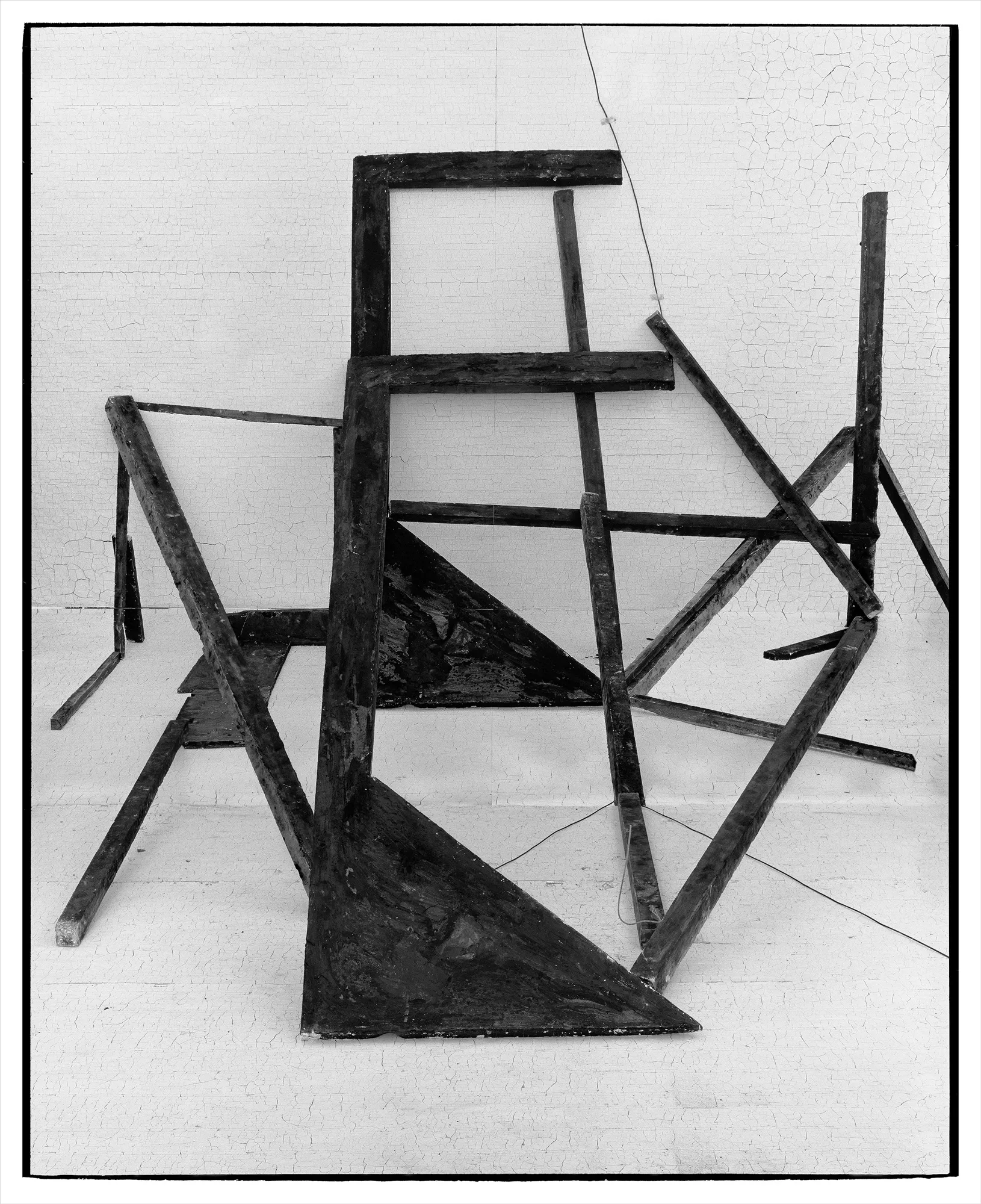 *Constructions* is my first NFT project, weaving together two of my most significant photographic series—*American Type* and *Hedonic Reversal*—as a unique set of 28 images. These architectural constructions, which I make in my studio and then photograph, reference forces of urban construction, destruction, and decay. Devoid of the depictions of labor from which these works were created and of which the work is inherently about, I also critique the ambiguity of post-war American abstraction and art world elitism. These works reference autobiographical threads in order to point to the larger sociopolitical backdrop upon which issues of migration and labor play out.