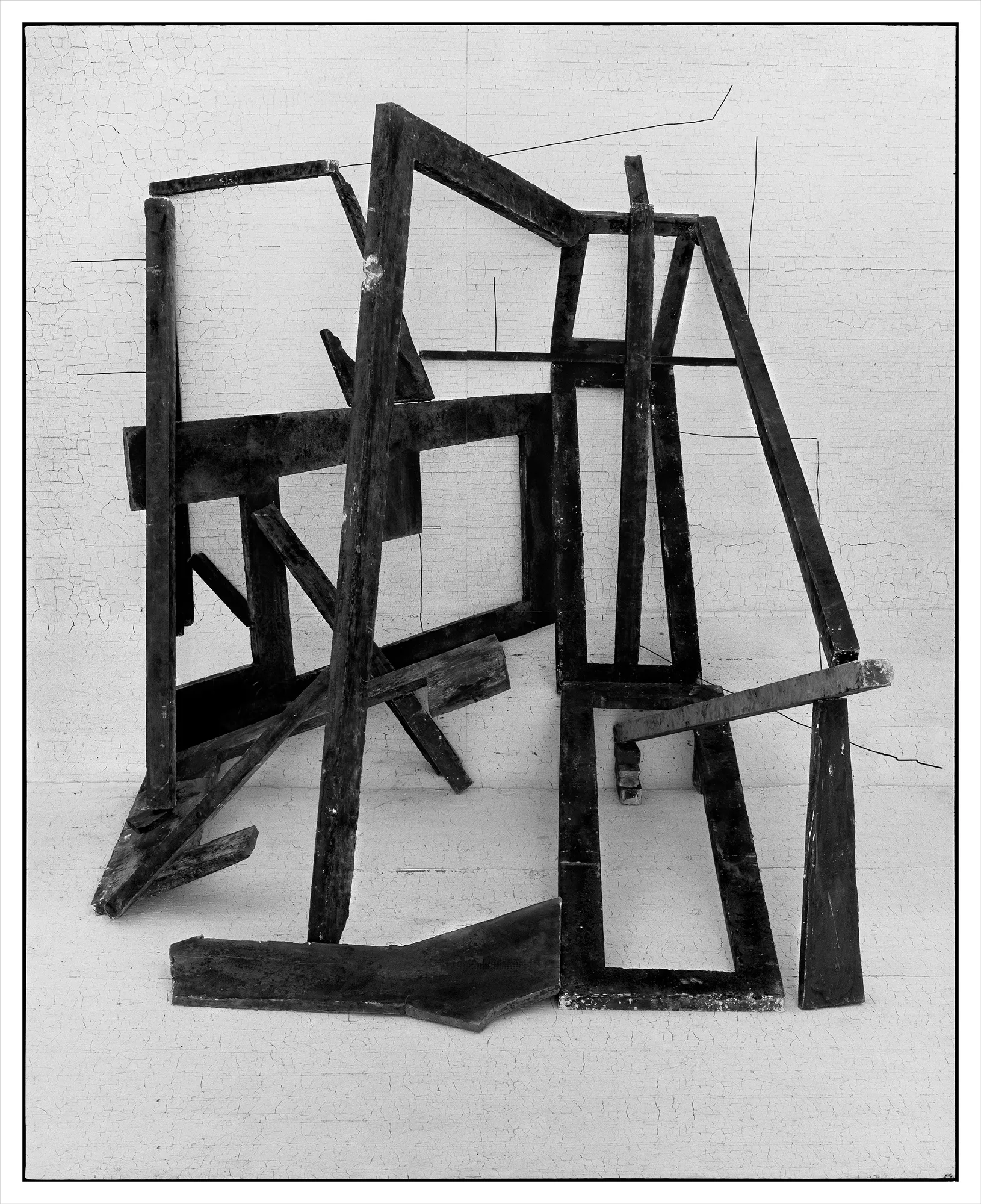 *Constructions* is my first NFT project, weaving together two of my most significant photographic series—*American Type* and *Hedonic Reversal*—as a unique set of 28 images. These architectural constructions, which I make in my studio and then photograph, reference forces of urban construction, destruction, and decay. Devoid of the depictions of labor from which these works were created and of which the work is inherently about, I also critique the ambiguity of post-war American abstraction and art world elitism. These works reference autobiographical threads in order to point to the larger sociopolitical backdrop upon which issues of migration and labor play out.