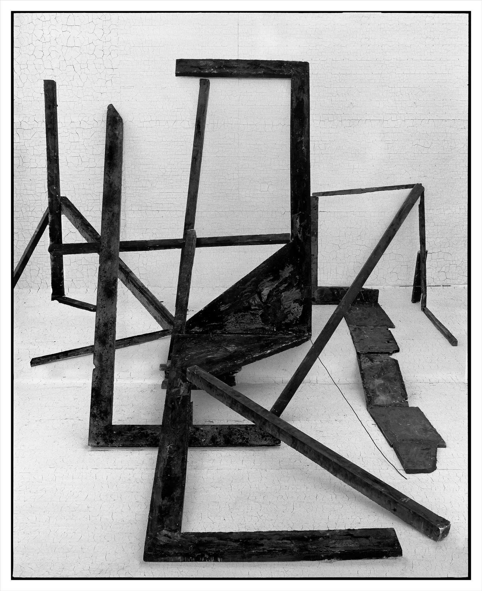 *Constructions* is my first NFT project, weaving together two of my most significant photographic series—*American Type* and *Hedonic Reversal*—as a unique set of 28 images. These architectural constructions, which I make in my studio and then photograph, reference forces of urban construction, destruction, and decay. Devoid of the depictions of labor from which these works were created and of which the work is inherently about, I also critique the ambiguity of post-war American abstraction and art world elitism. These works reference autobiographical threads in order to point to the larger sociopolitical backdrop upon which issues of migration and labor play out.