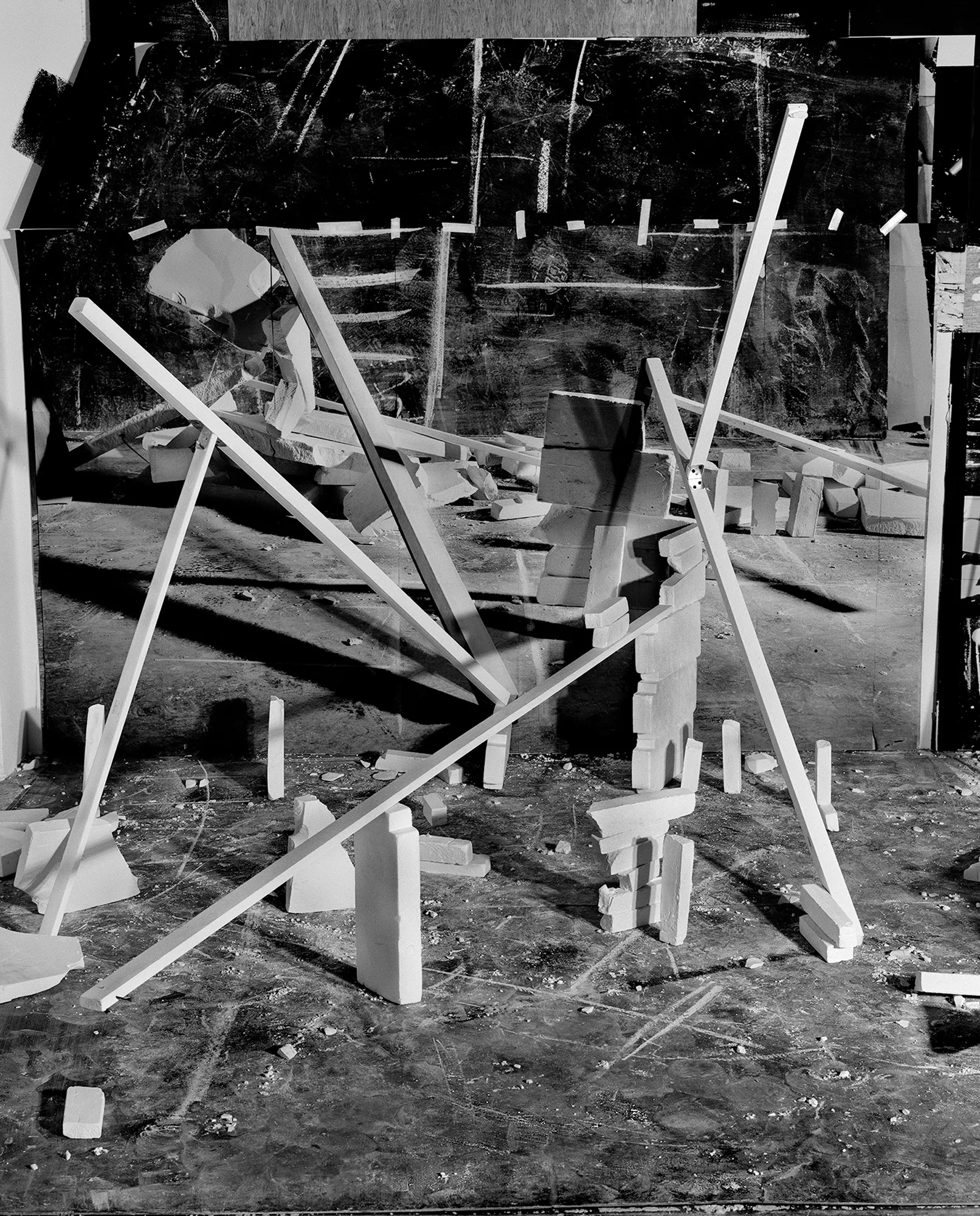 *Constructions* is my first NFT project, weaving together two of my most significant photographic series—*American Type* and *Hedonic Reversal*—as a unique set of 28 images. These architectural constructions, which I make in my studio and then photograph, reference forces of urban construction, destruction, and decay. Devoid of the depictions of labor from which these works were created and of which the work is inherently about, I also critique the ambiguity of post-war American abstraction and art world elitism. These works reference autobiographical threads in order to point to the larger sociopolitical backdrop upon which issues of migration and labor play out.
