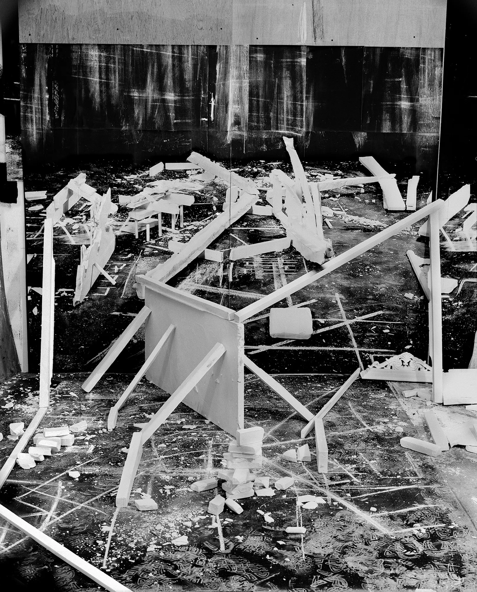 *Constructions* is my first NFT project, weaving together two of my most significant photographic series—*American Type* and *Hedonic Reversal*—as a unique set of 28 images. These architectural constructions, which I make in my studio and then photograph, reference forces of urban construction, destruction, and decay. Devoid of the depictions of labor from which these works were created and of which the work is inherently about, I also critique the ambiguity of post-war American abstraction and art world elitism. These works reference autobiographical threads in order to point to the larger sociopolitical backdrop upon which issues of migration and labor play out.